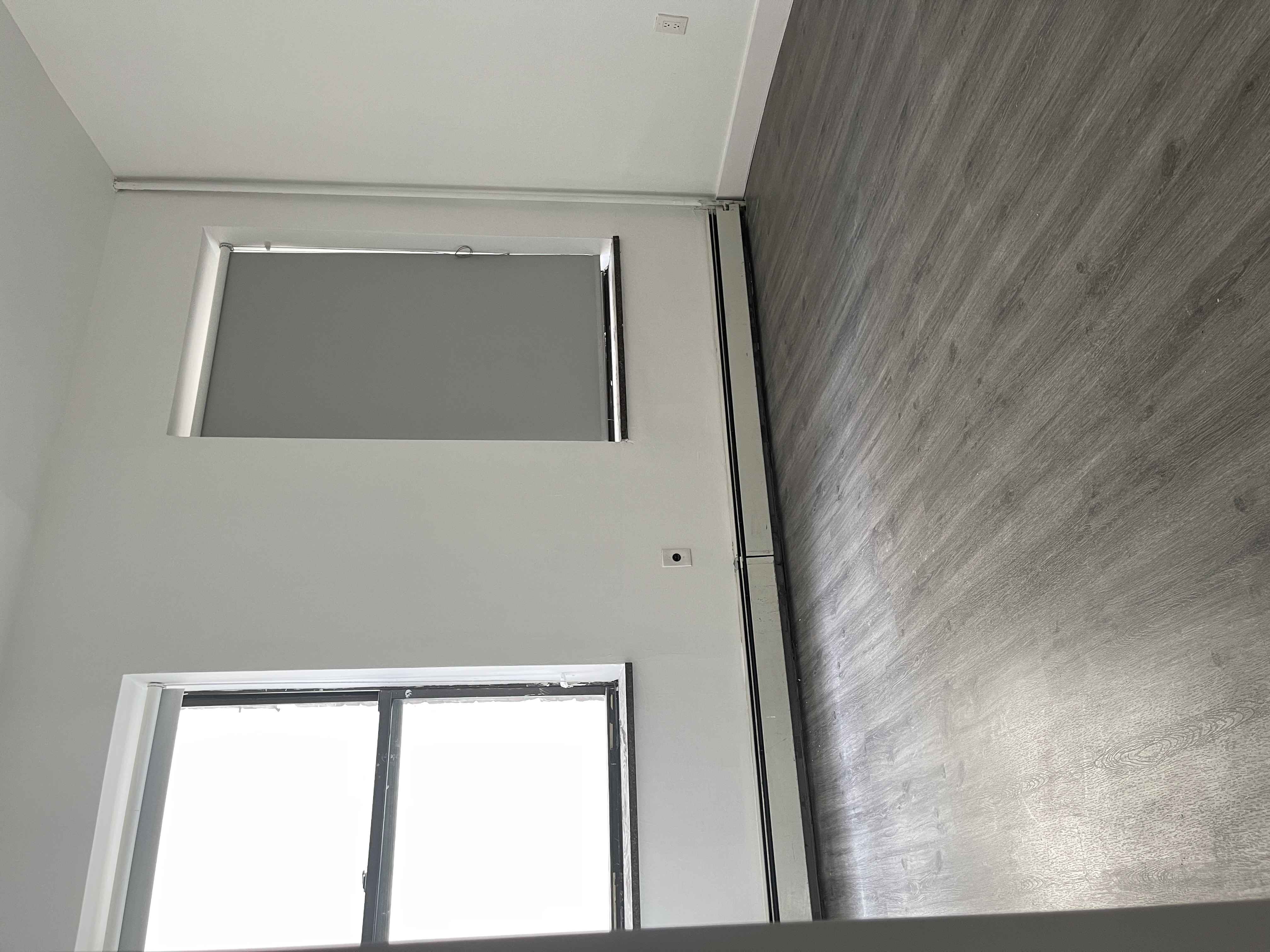 1999 3rd Avenue, Unit 1 Manhattan, NY 10029 - Photo 9 of 23 a view of a room with wooden floor and window