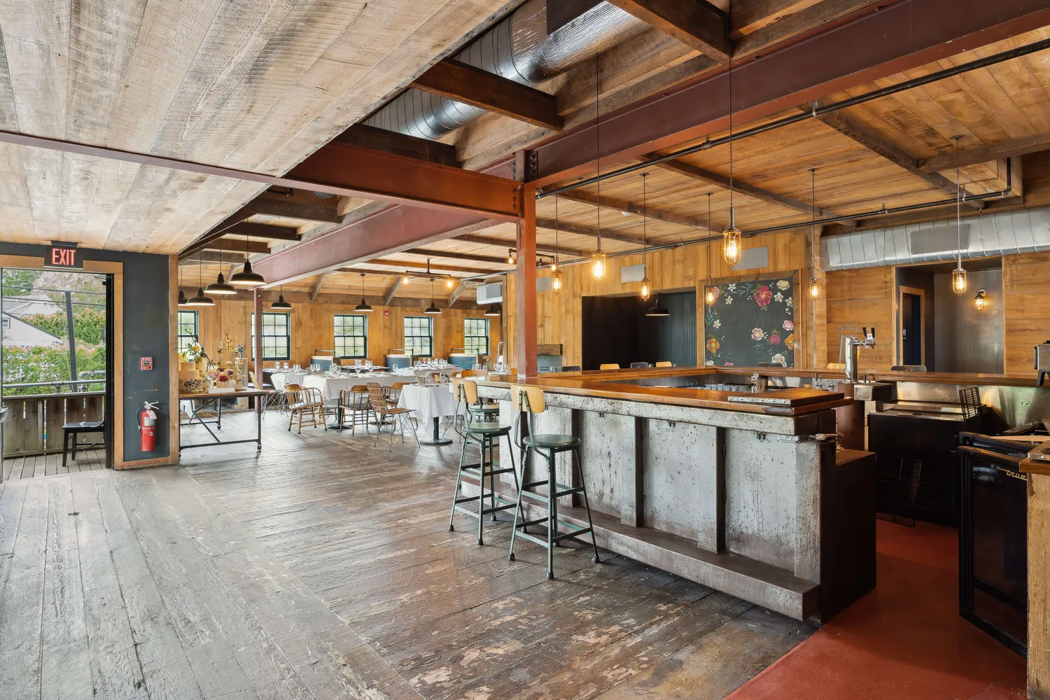 a view of a patio with dining table and chairs