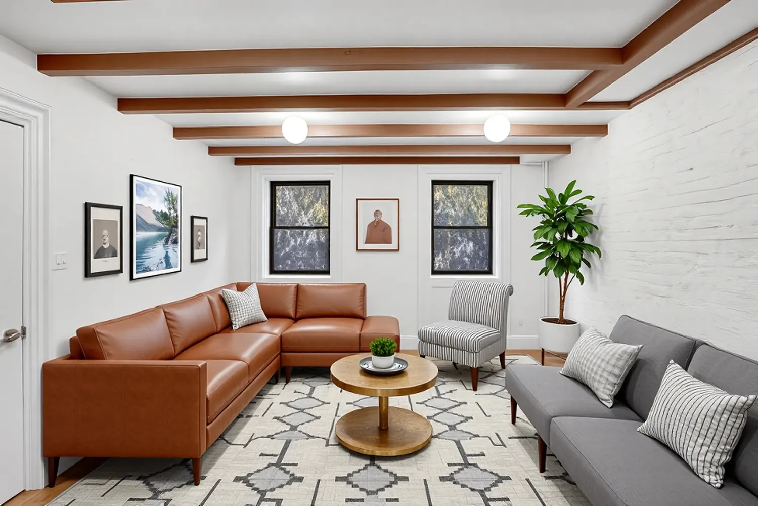 a living room with furniture a rug and a potted plant