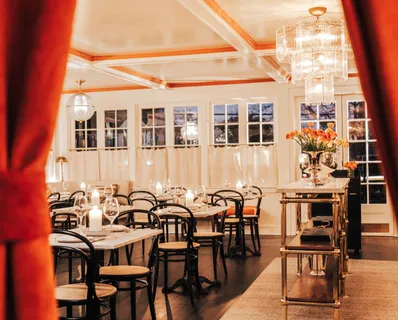 an outdoor space with patio furniture and wooden floor