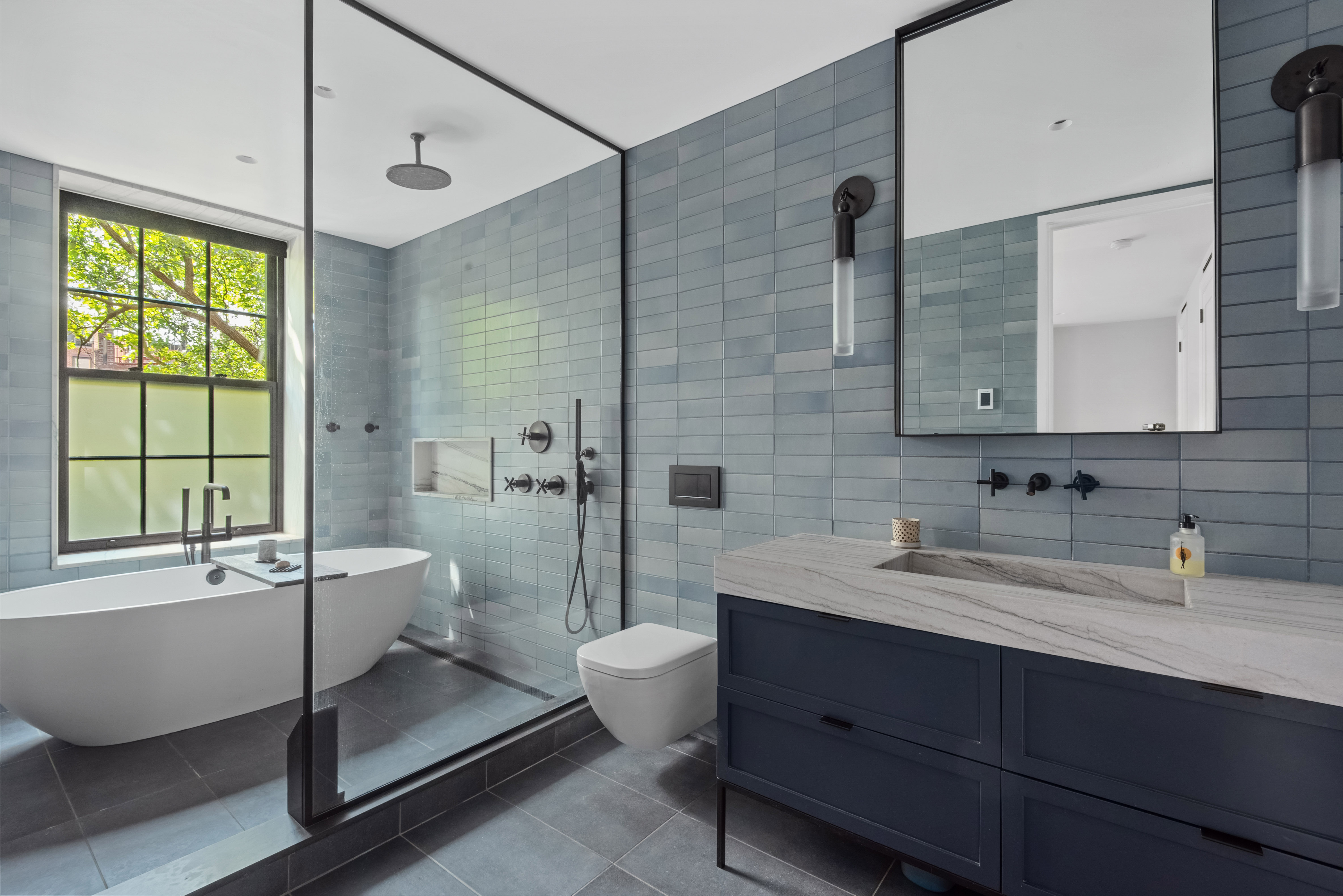 9 Garden Place, Unit 2 Brooklyn, NY 11201 - Photo 9 of 18 a bathroom with a double vanity sink toilet mirror and bathtub