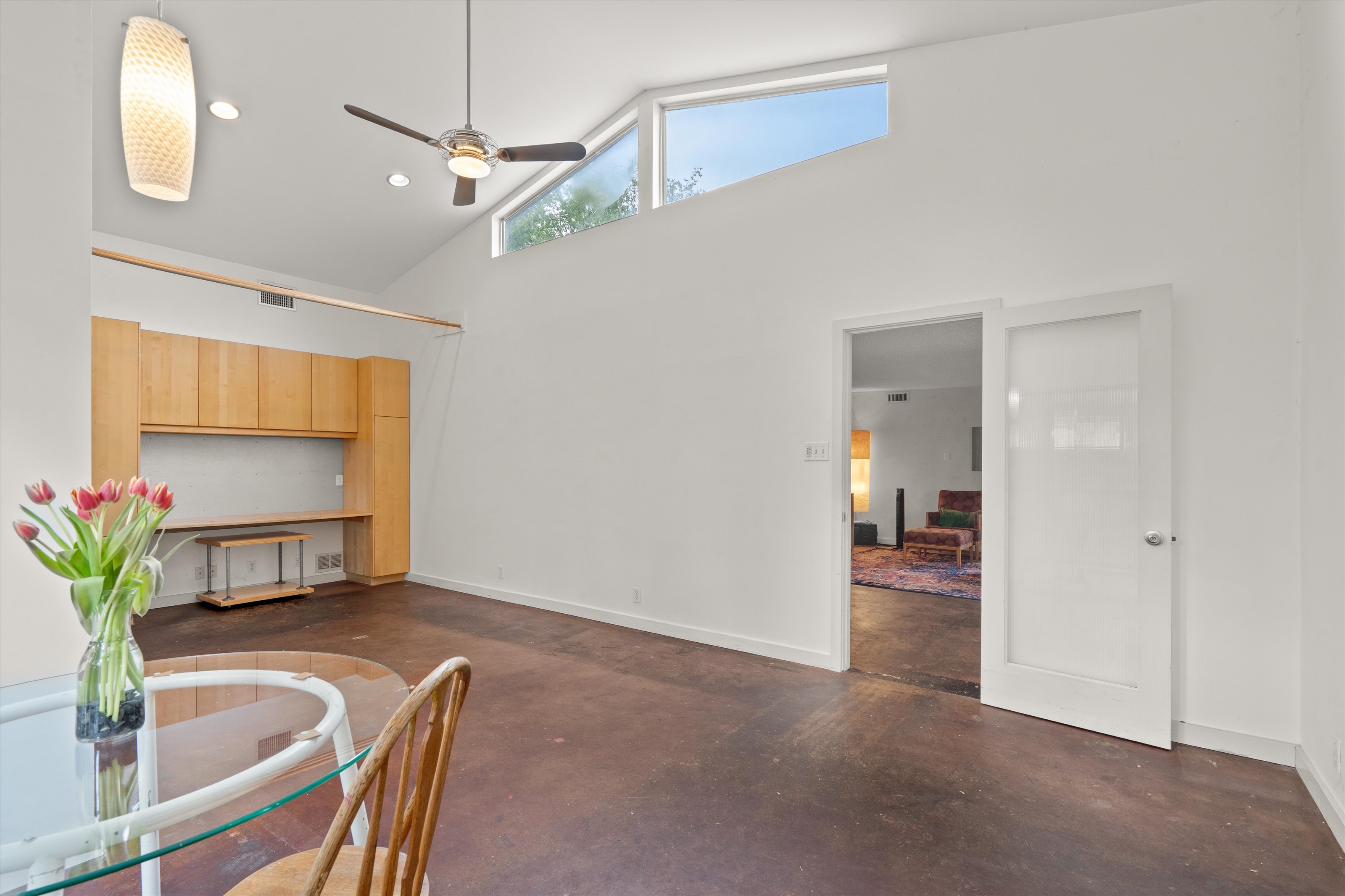 4614 Jinx Avenue Austin, TX 78745 - Photo 25 of 40 a view of a livingroom and a dining room with a chandelier fan