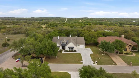 an aerial view of a house with a garden