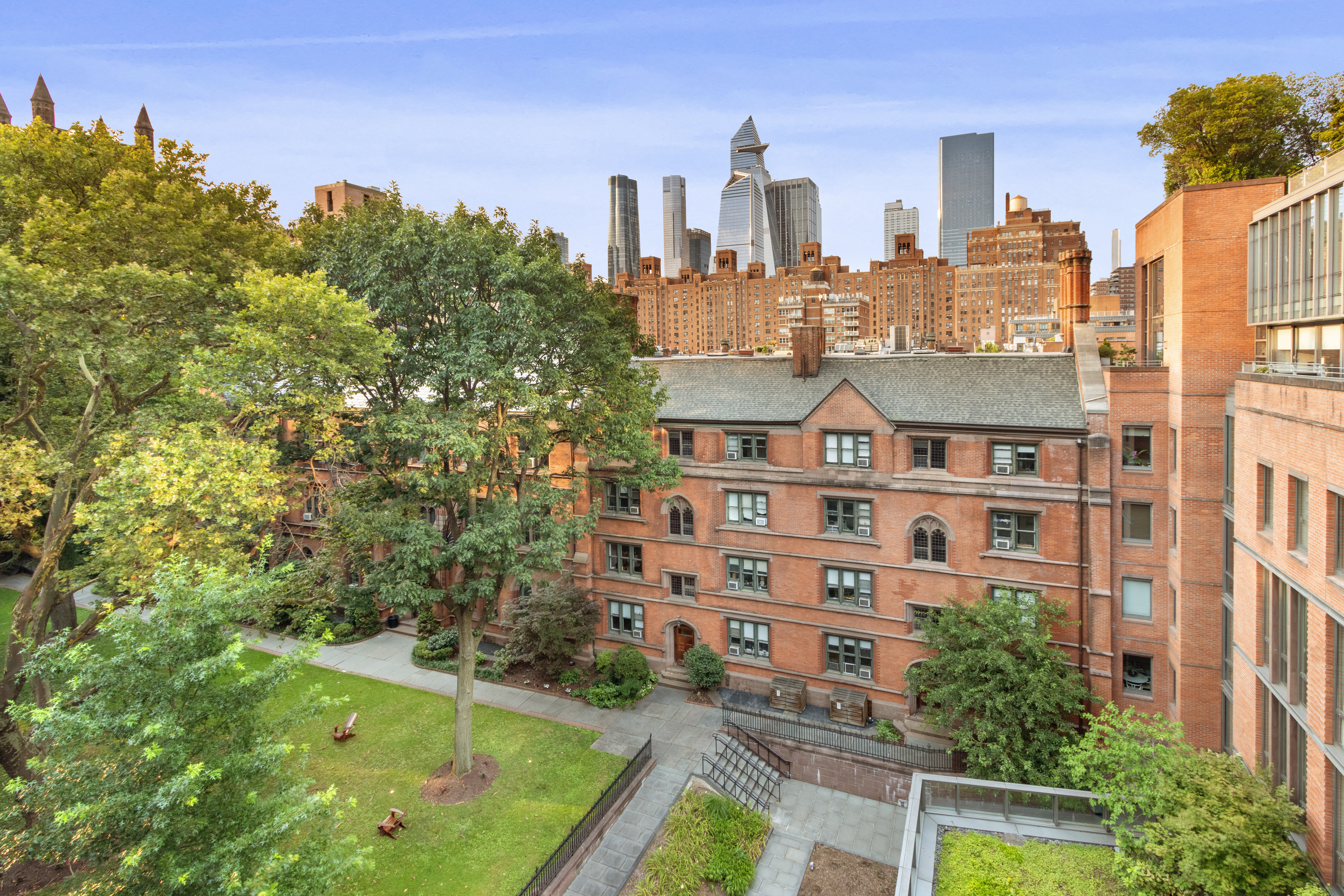 177 9th Avenue, Unit PHA Manhattan, NY 10011 - Photo 19 of 28 a view of a tall building next to a yard