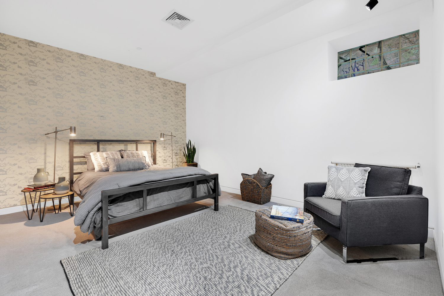 200 Mercer Street, Unit MAIS-G Manhattan, NY 10012 - Photo 11 of 17 a bedroom with furniture and a couch