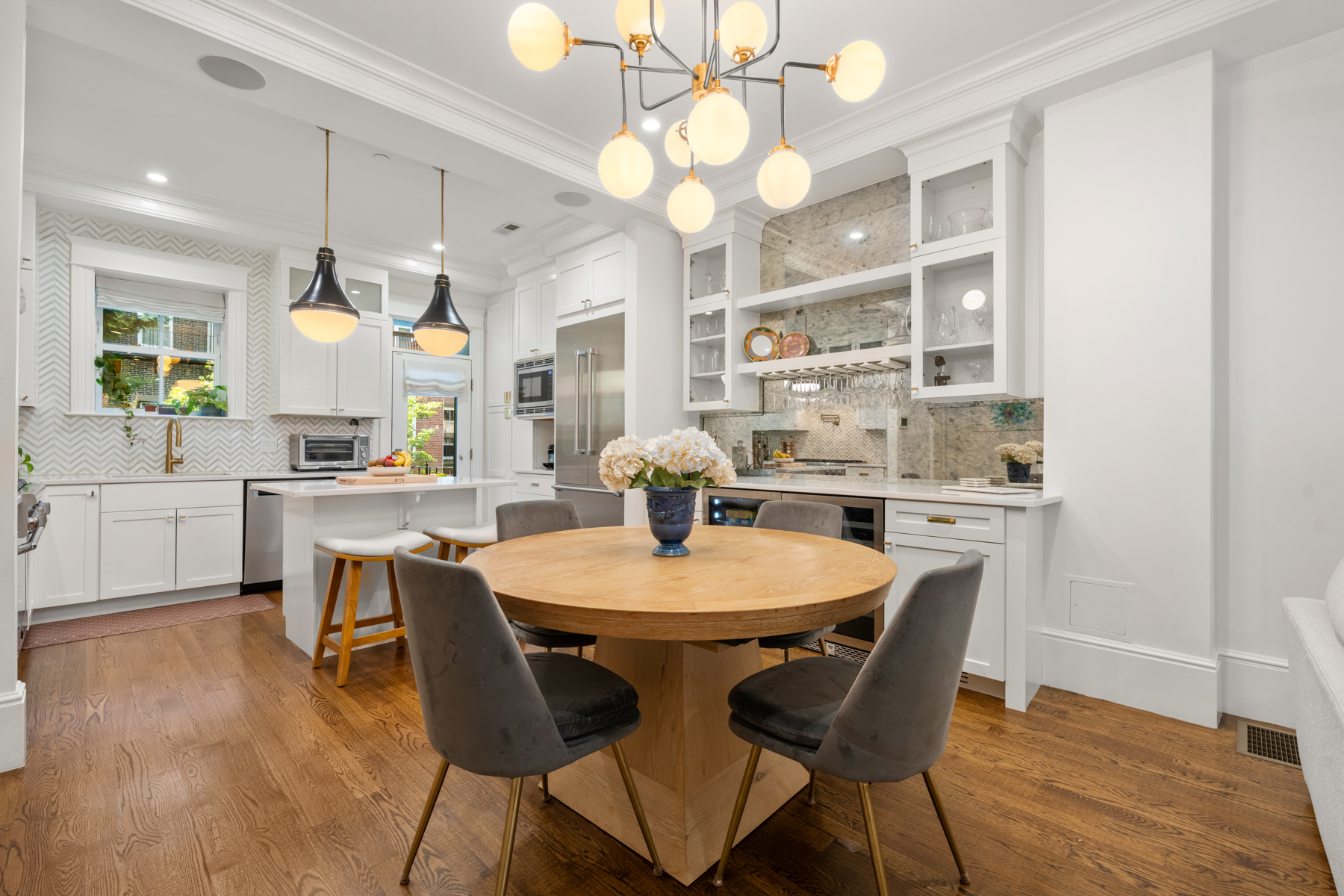 34 Dwight Street, Unit 1 Boston, MA 02118 - Photo 6 of 33 a dining room with wooden floor a chandelier a wooden table and chairs