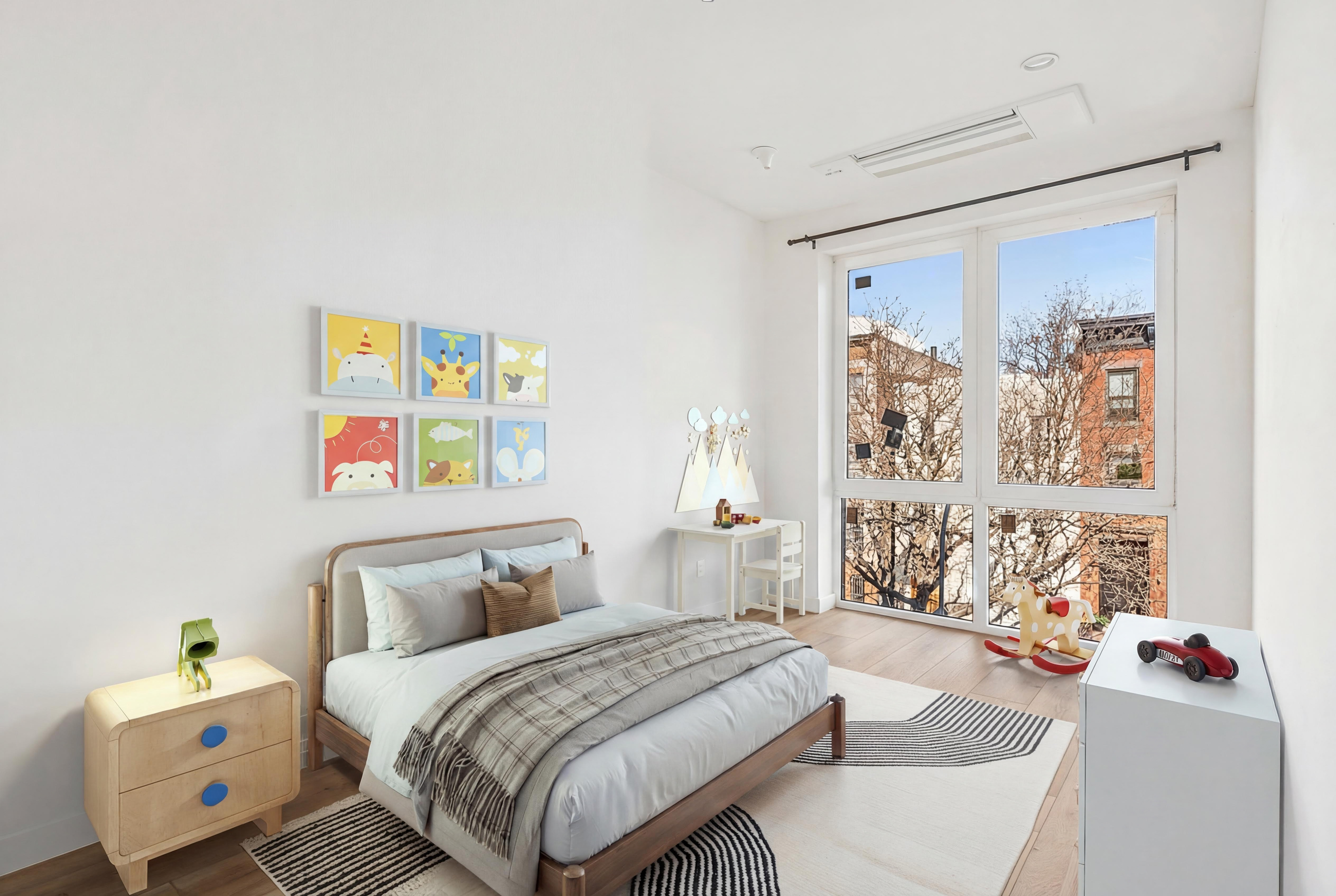 176 12th Street, Unit 3 Brooklyn, NY 11215 - Photo 6 of 11 a bedroom with a bed and a couch