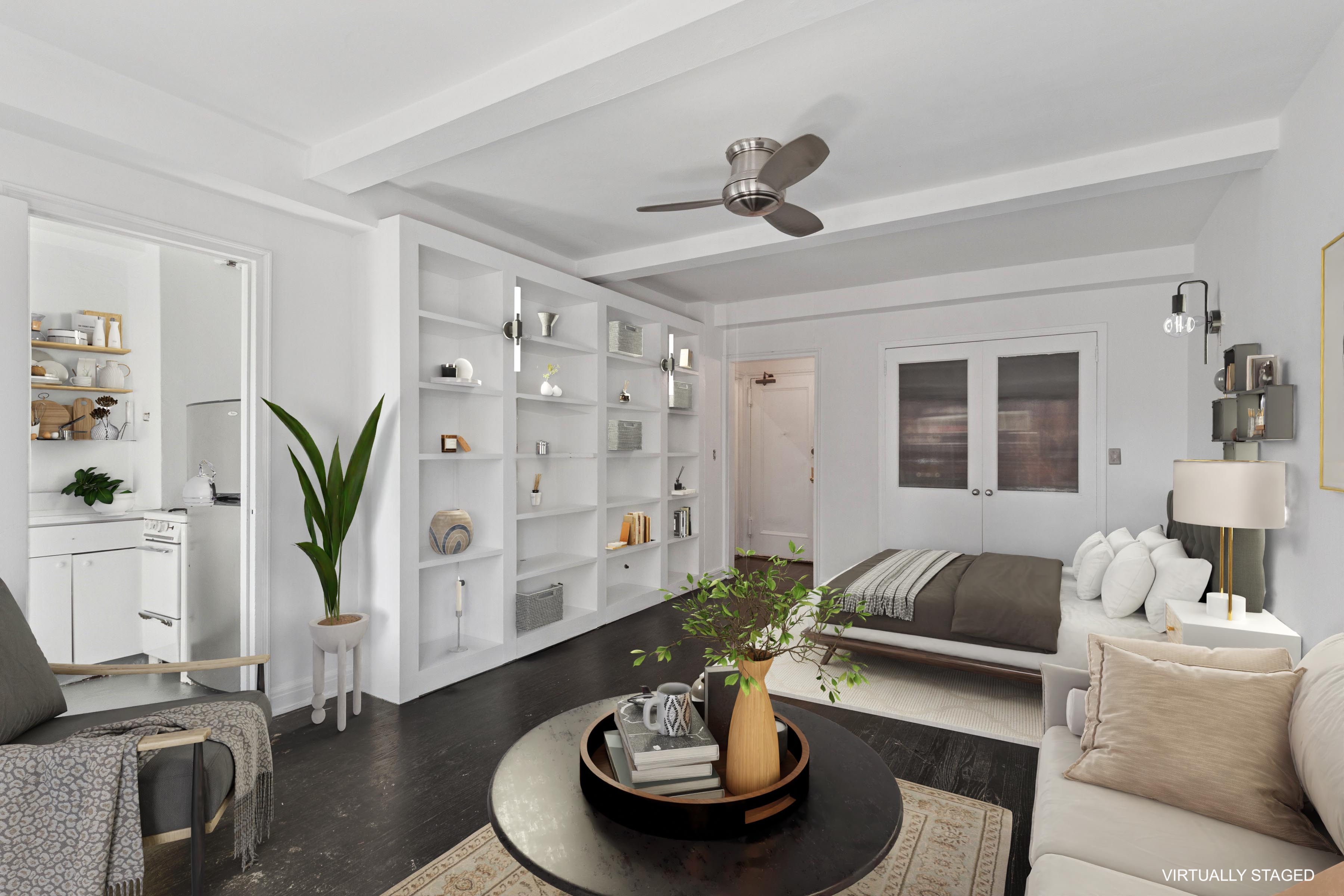 201 West 16th Street, Unit 7C Manhattan, NY 10011 - Photo 3 of 8 a living room with furniture and wooden floor