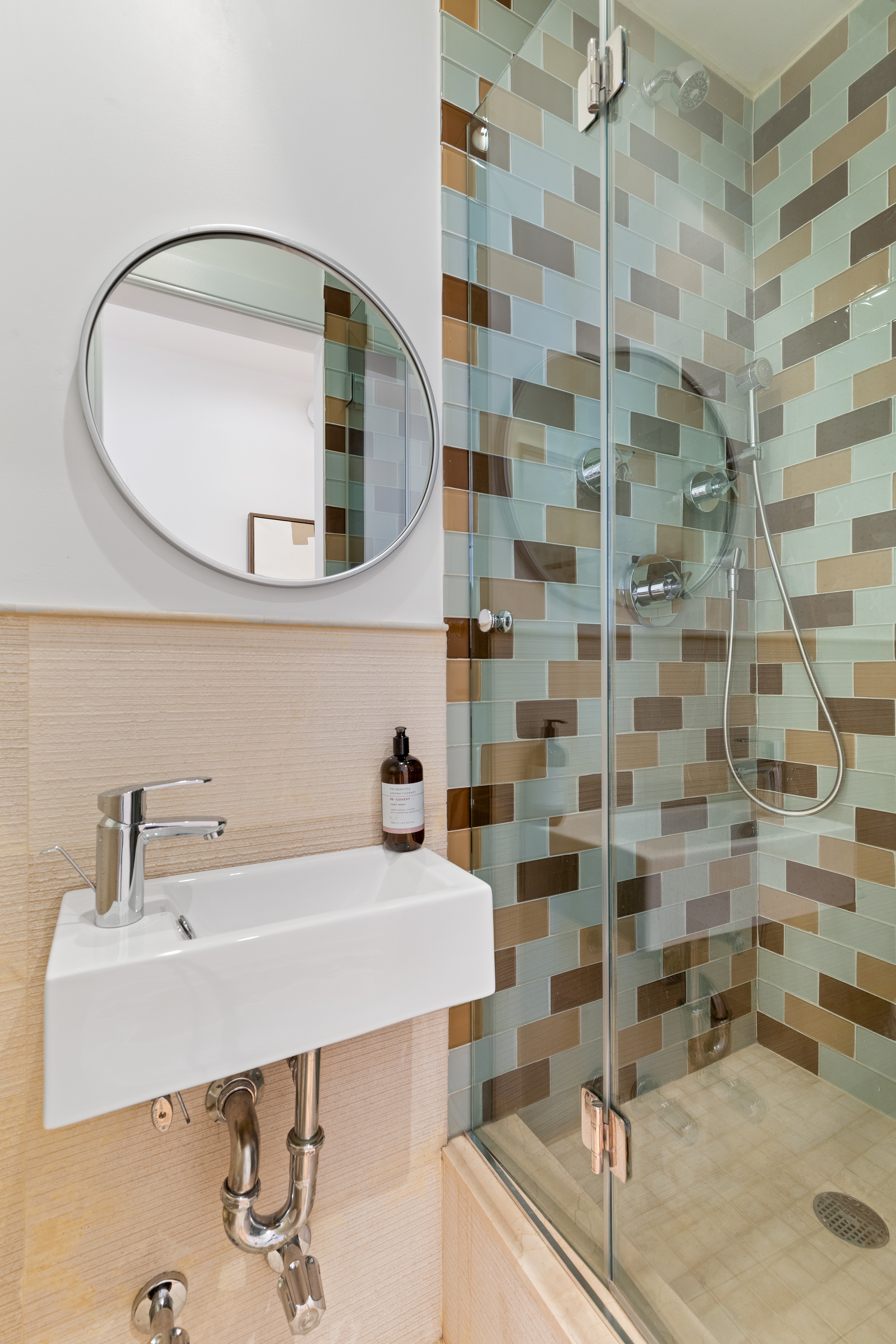 59 West 71st Street, Unit 9C Manhattan, NY 10023 - Photo 8 of 11 a bathroom with a sink and a mirror