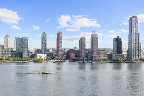 a lake with tall building
