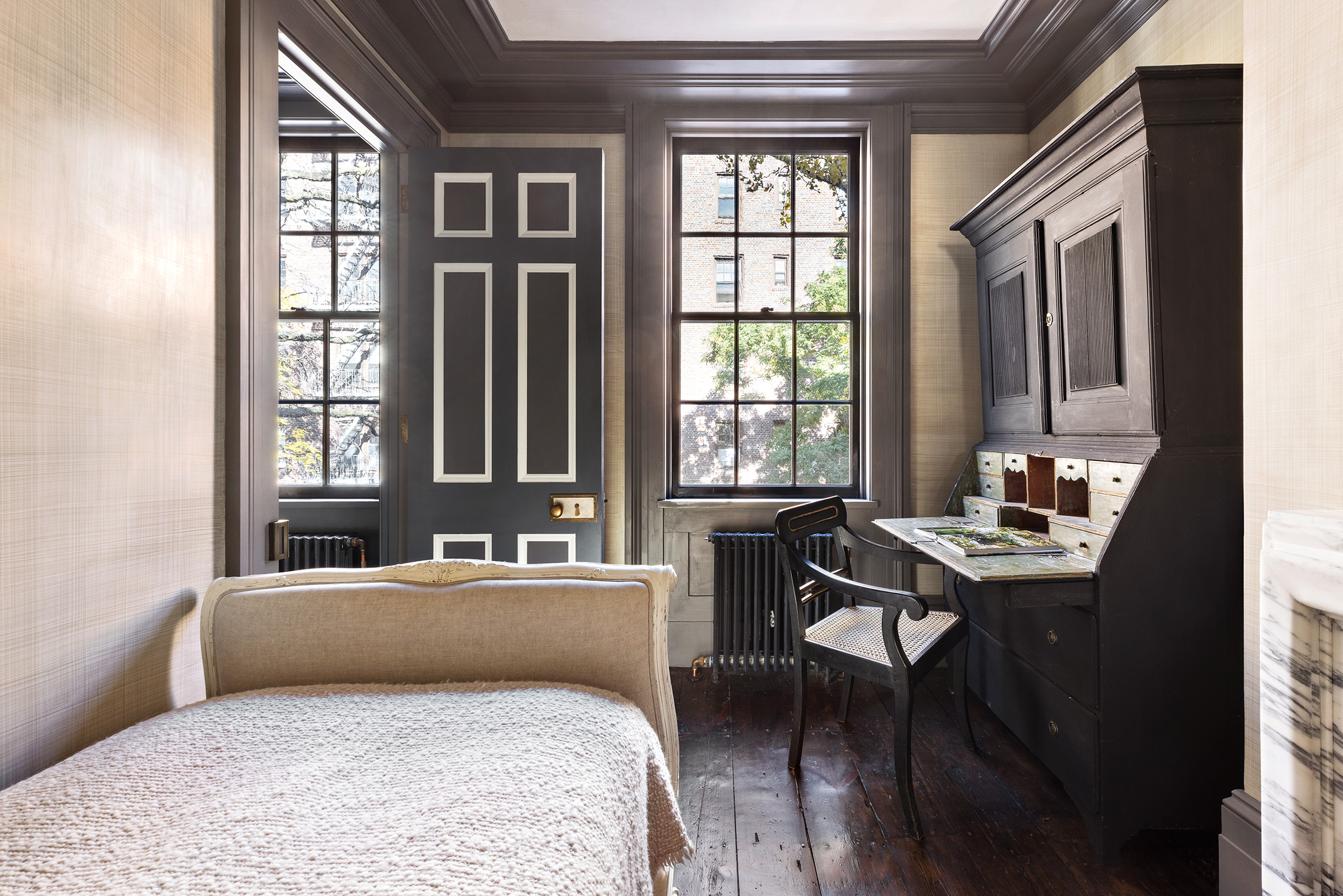 68 Morton Street Manhattan, NY 10014 - Photo 14 of 21 a bath room with a bed and a window