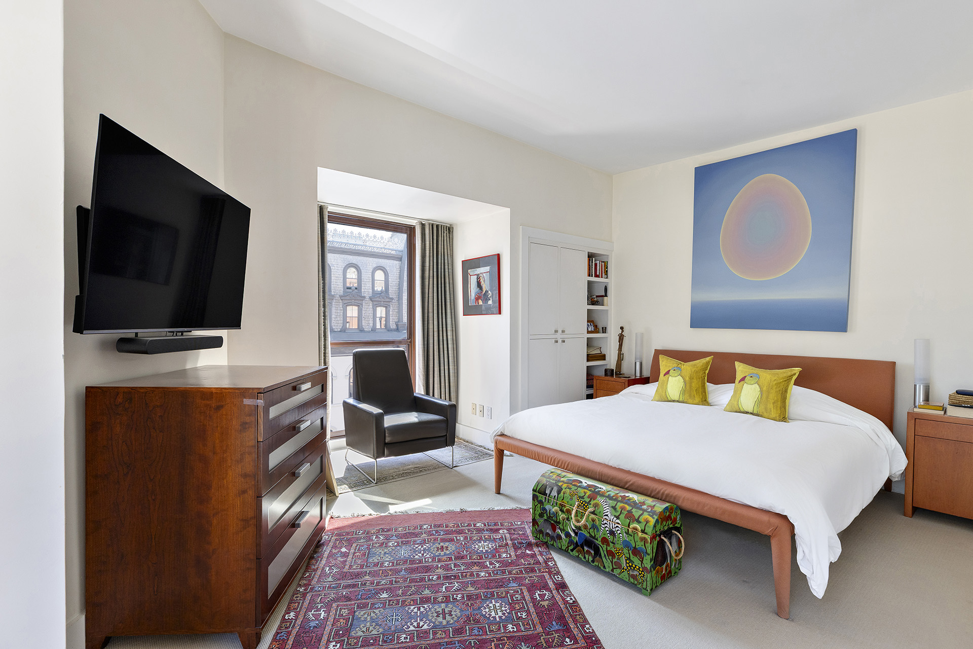 889 Broadway, Unit PHA Manhattan, NY 10003 - Photo 5 of 11 a bedroom with a bed and flat screen tv