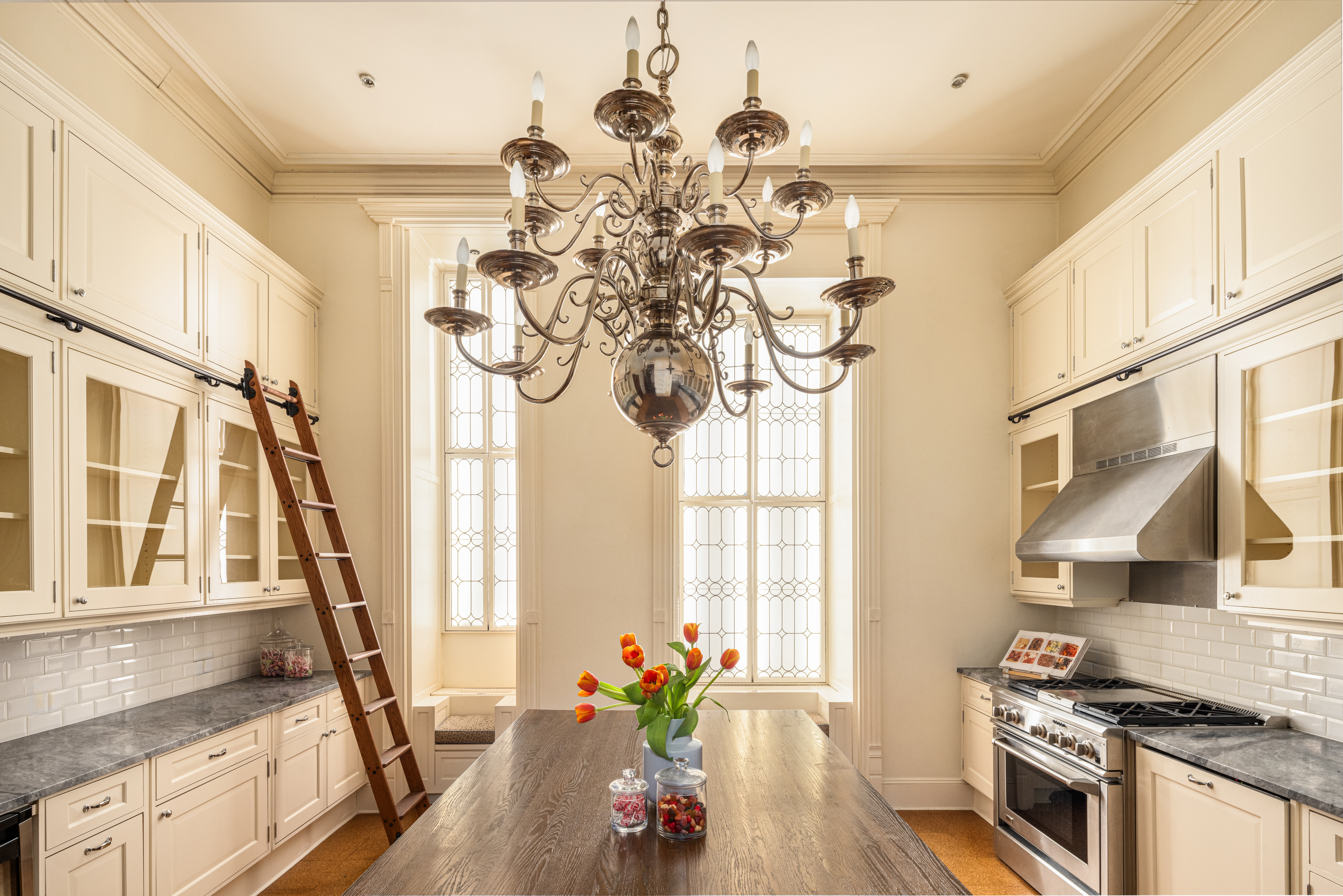 205 West 57th Street, Unit 4B Manhattan, NY 10019 - Photo 8 of 14 a vase of flowers sitting on a table in a kitchen
