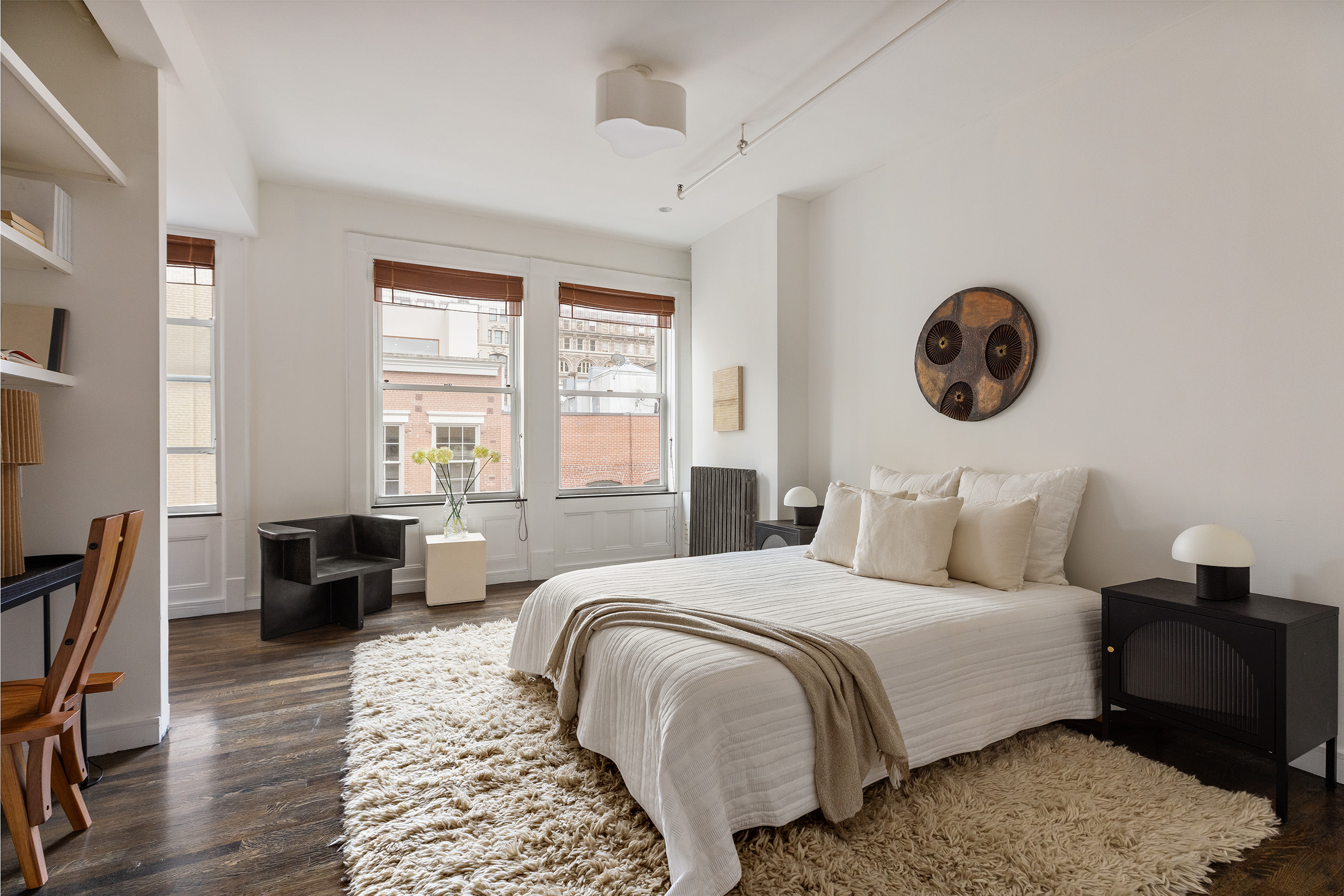 169 Mercer Street, Unit PH Manhattan, NY 10012 - Photo 11 of 15 a bedroom with a bed and a couch