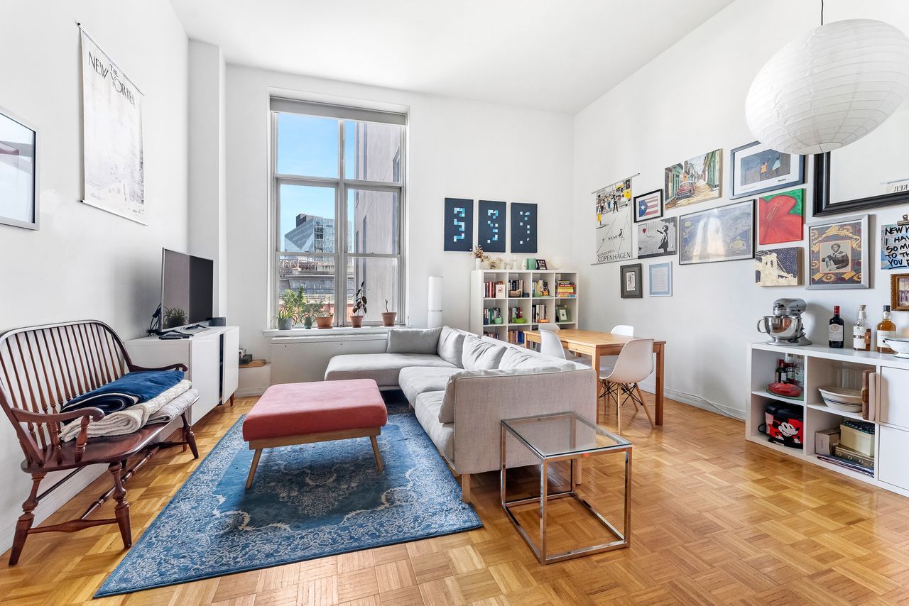 a living room with furniture and a rug