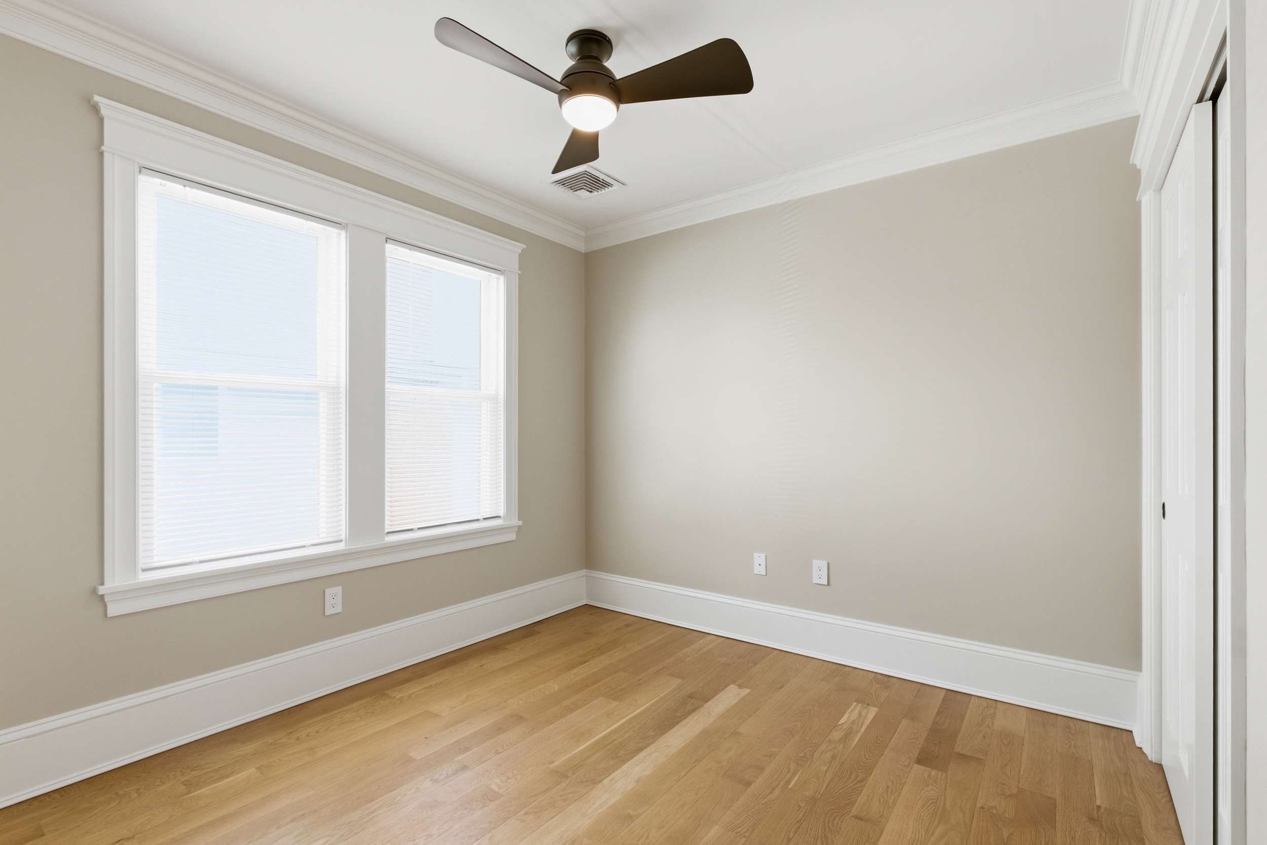 48-50 Amsden Street, Unit 2 Arlington, MA 02474 - Photo 30 of 34 an empty room with a window and a fan