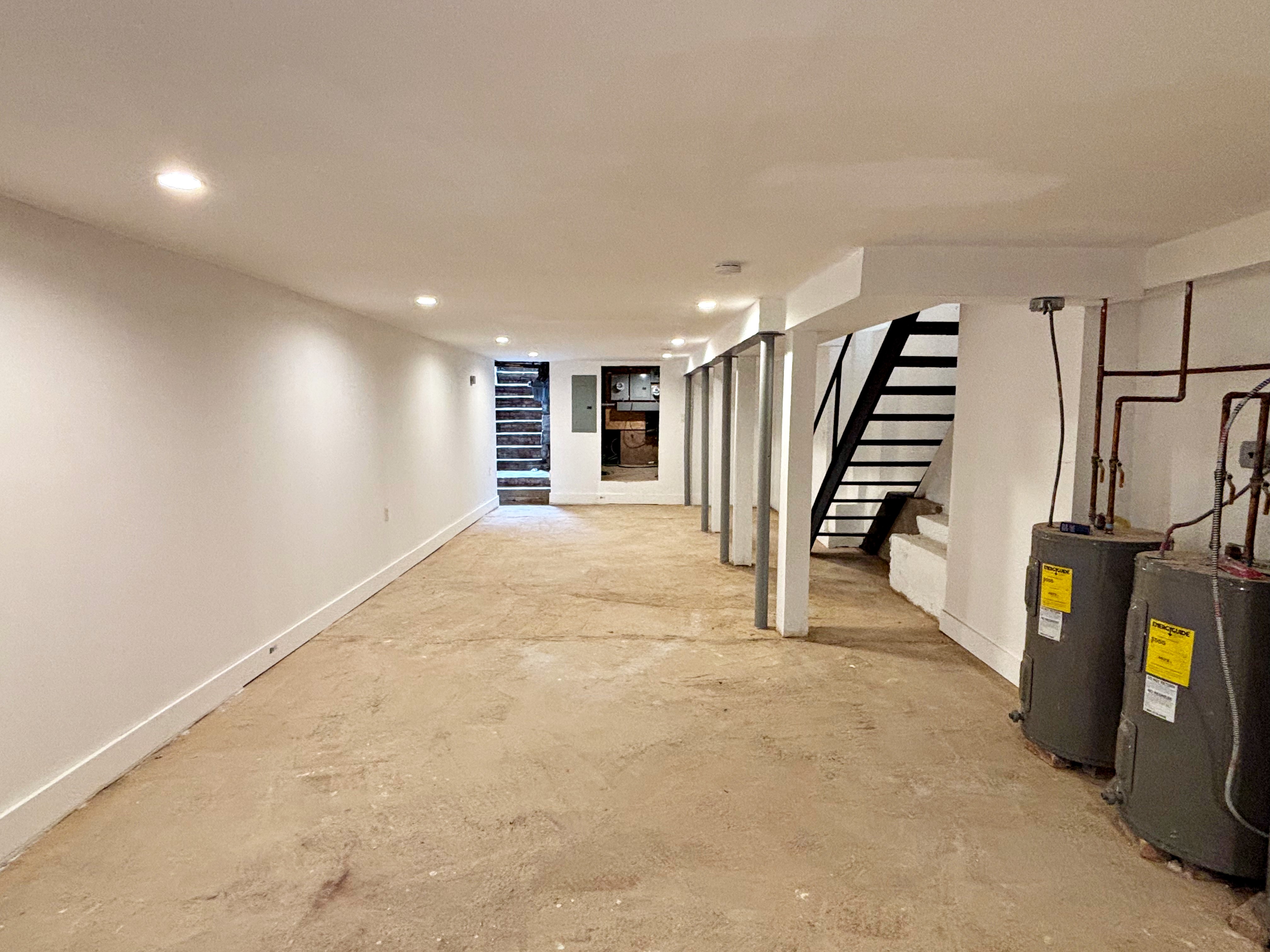 385 Nostrand Avenue, Unit Undisclosed Brooklyn, NY 11216 - Photo 12 of 27 a view of an empty room with stairs