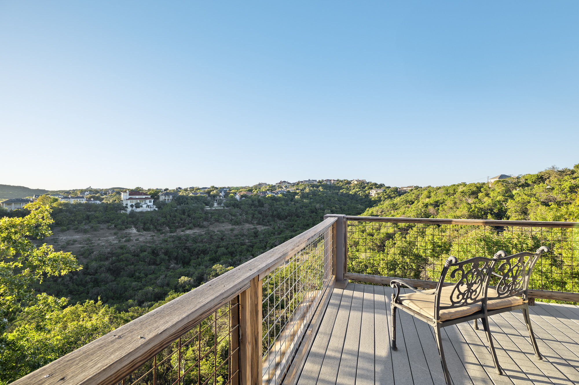 1605 The High Road Austin, TX 78746 - Photo 30 of 45 a view of a balcony with mountain view and wooden floor
