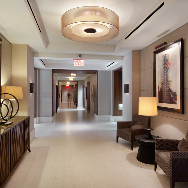 155 West 68th Street, Unit 1907 Manhattan, NY 10023 - Photo 15 of 20 a lobby with furniture and a mirror