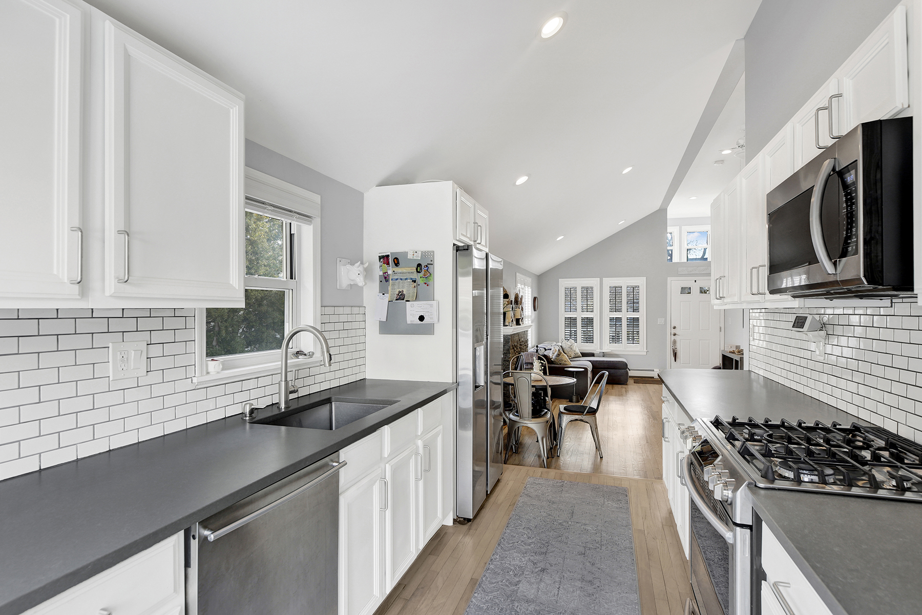 4-53 Beach 142nd Street Queens, NY 11694 - Photo 17 of 39 a kitchen with stainless steel appliances a stove sink microwave and cabinets