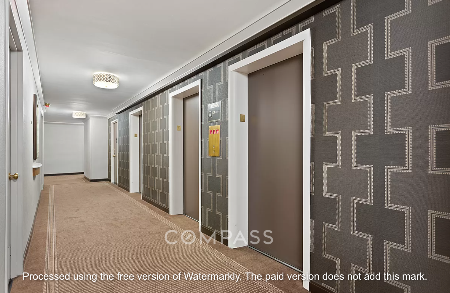 345 East 81st Street, Unit 8G Manhattan, NY 10028 - Photo 16 of 17 a view of a hallway with wooden shelves