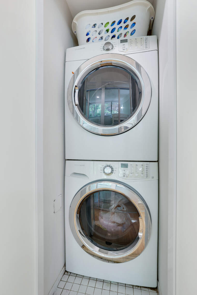 344 West 23rd Street, Unit 1E Manhattan, NY 10011 - Photo 17 of 19 a utility room with dryer and washer