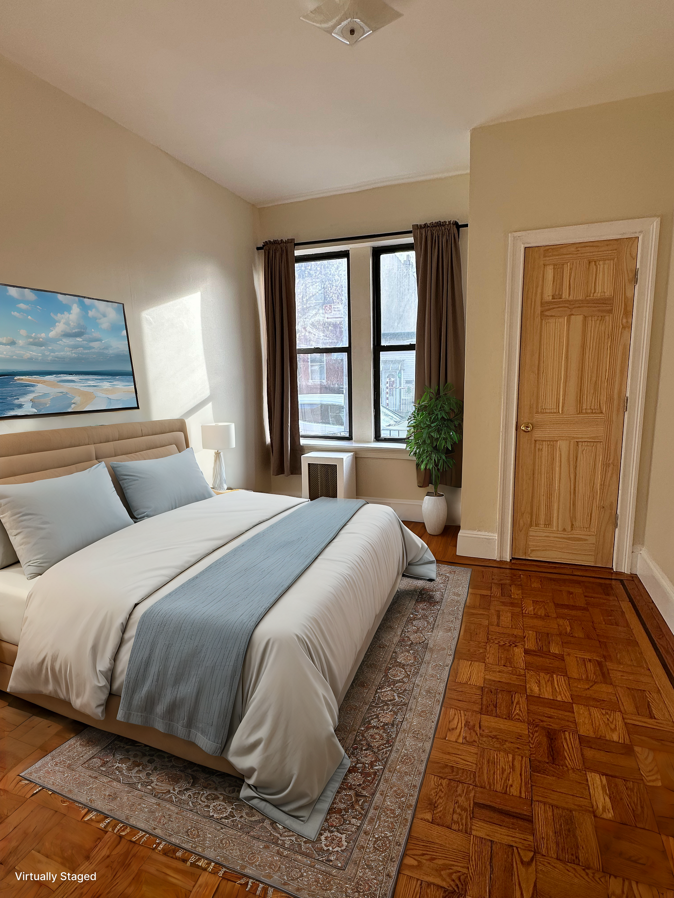 31-40 42nd Street, Unit 1F Queens, NY 11103 - Photo 6 of 9 a spacious bedroom with a large bed and a window