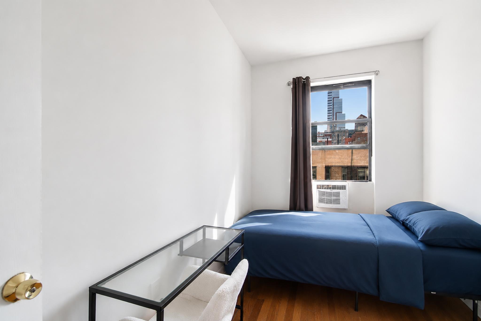 205 West 103rd Street, Unit 6B Manhattan, NY 10025 - Photo 5 of 11 a bedroom with a bed and a window