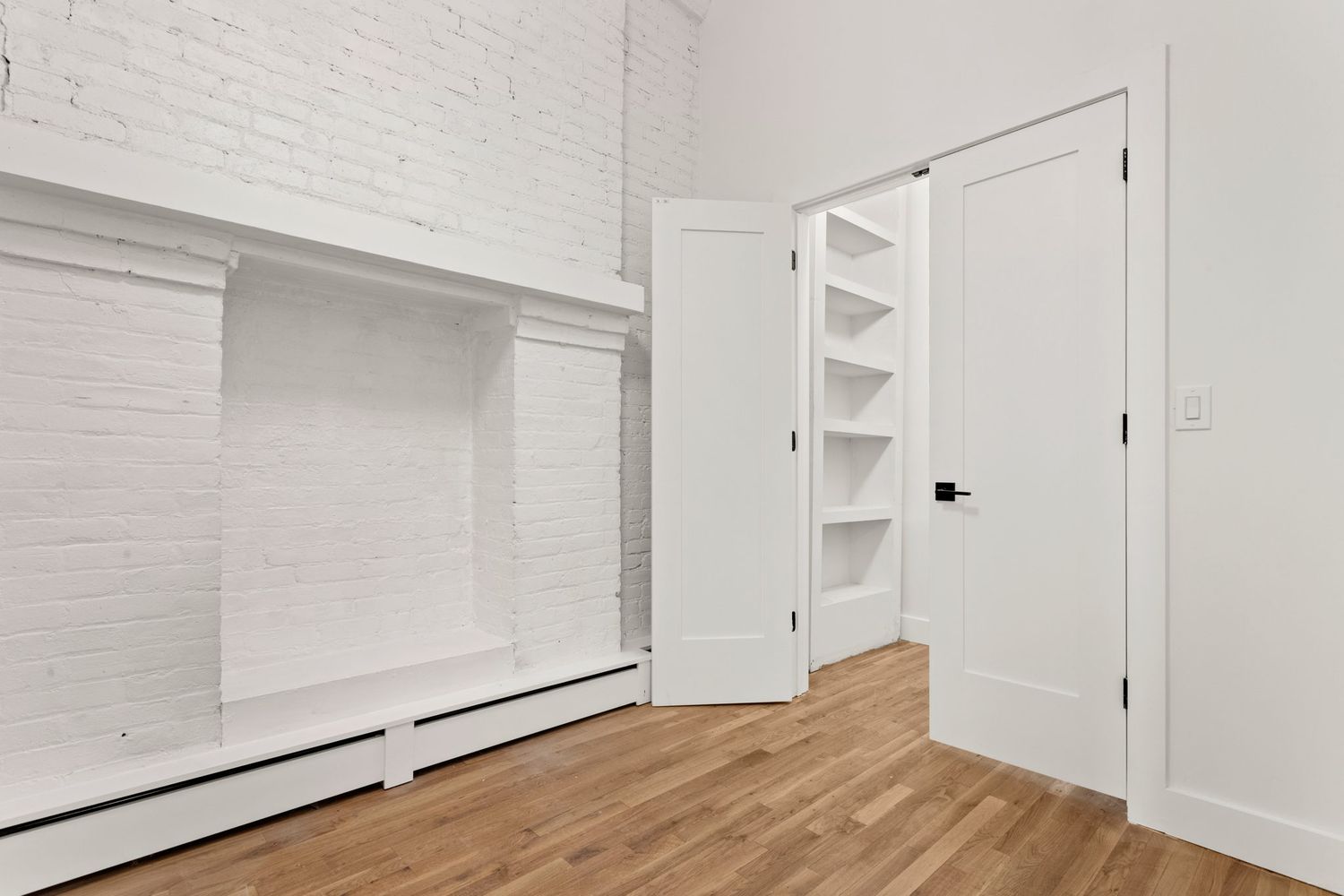 717 Manhattan Avenue, Unit 2A Brooklyn, NY 11222 - Photo 12 of 17 a view of an empty room with wooden floor