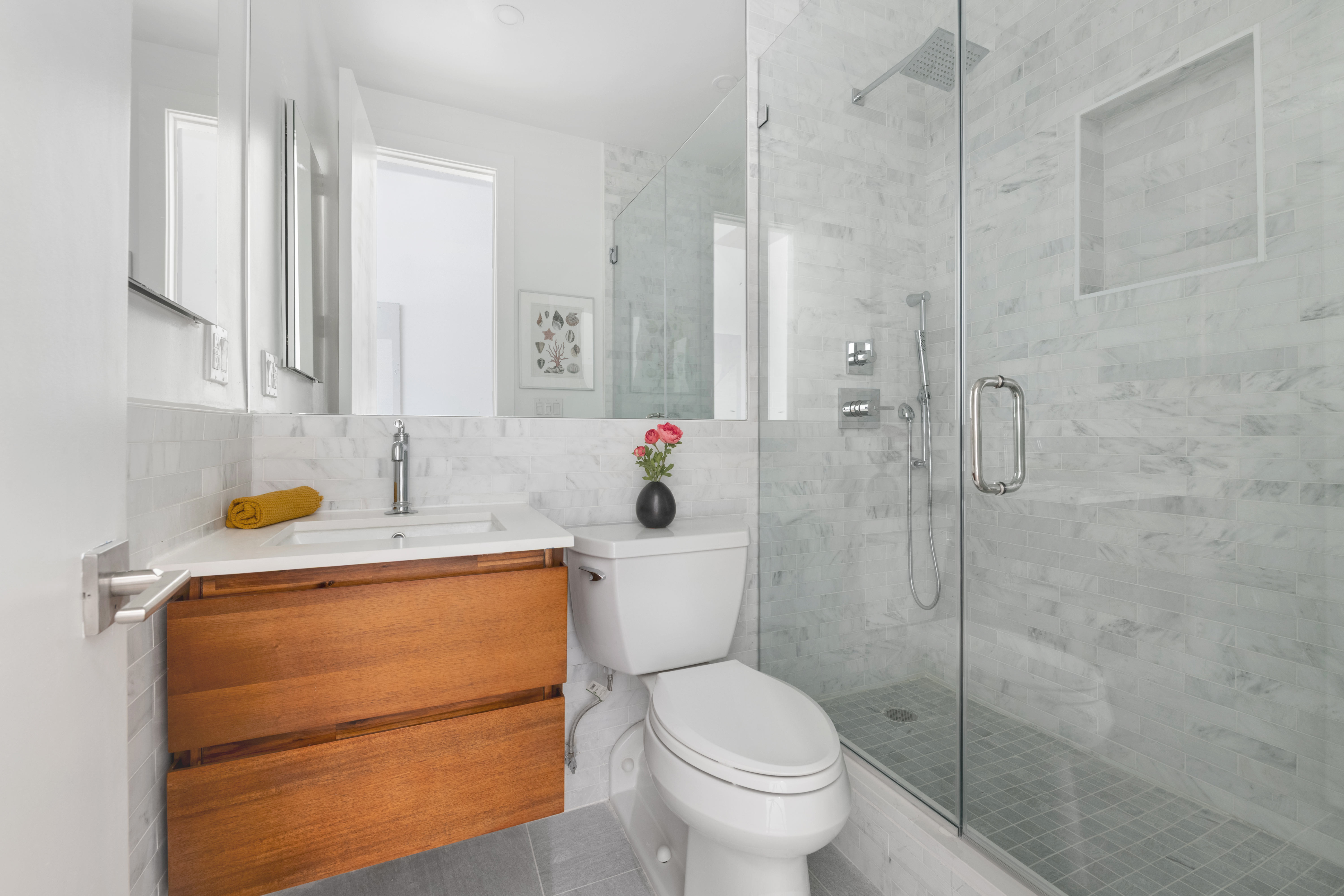 96 Schermerhorn Street, Unit 11F Brooklyn, NY 11201 - Photo 9 of 13 a bathroom with a sink a toilet and shower