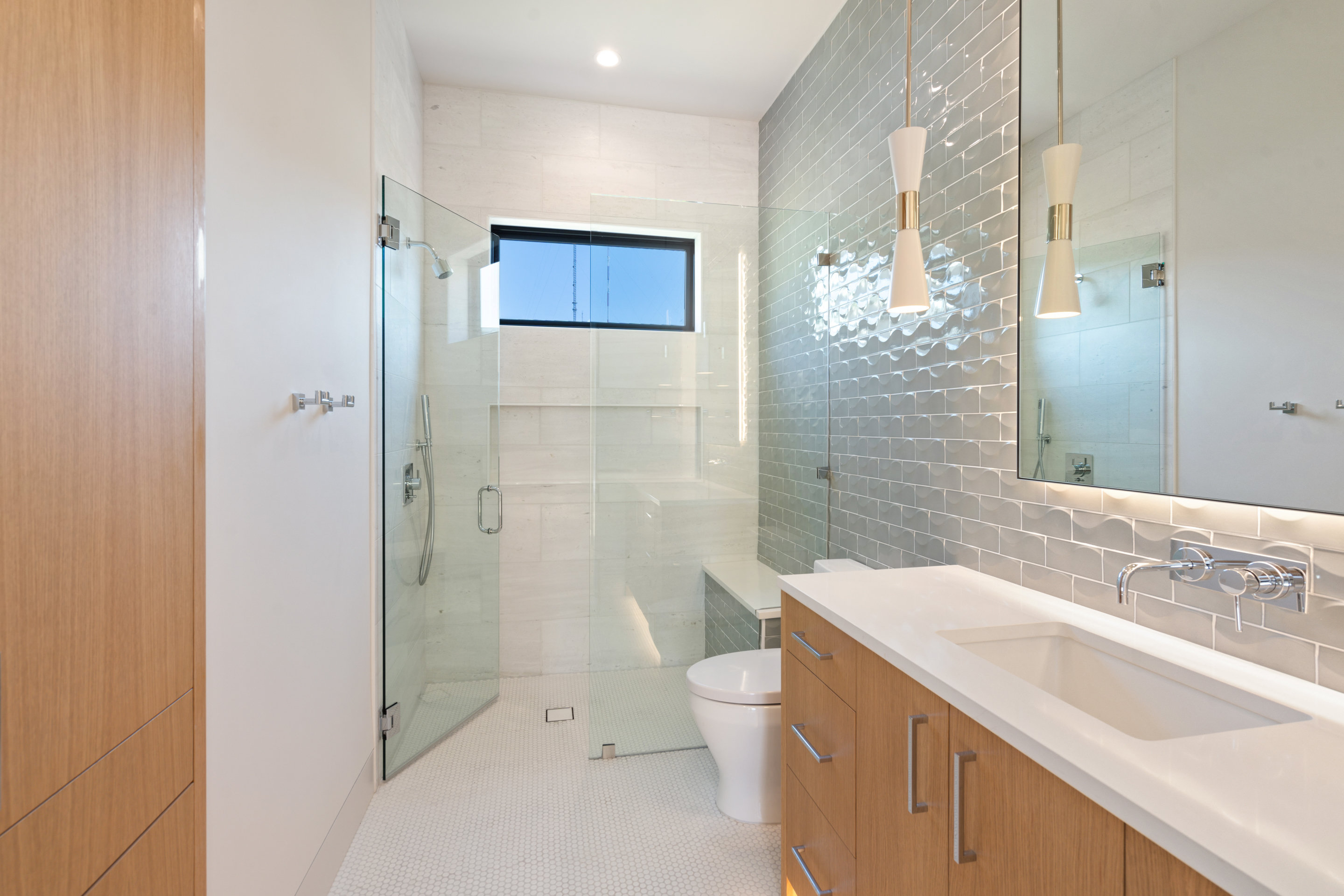 1905 Hallam Drive Austin, TX 78746 - Photo 26 of 39 a bathroom with a sink a toilet and shower