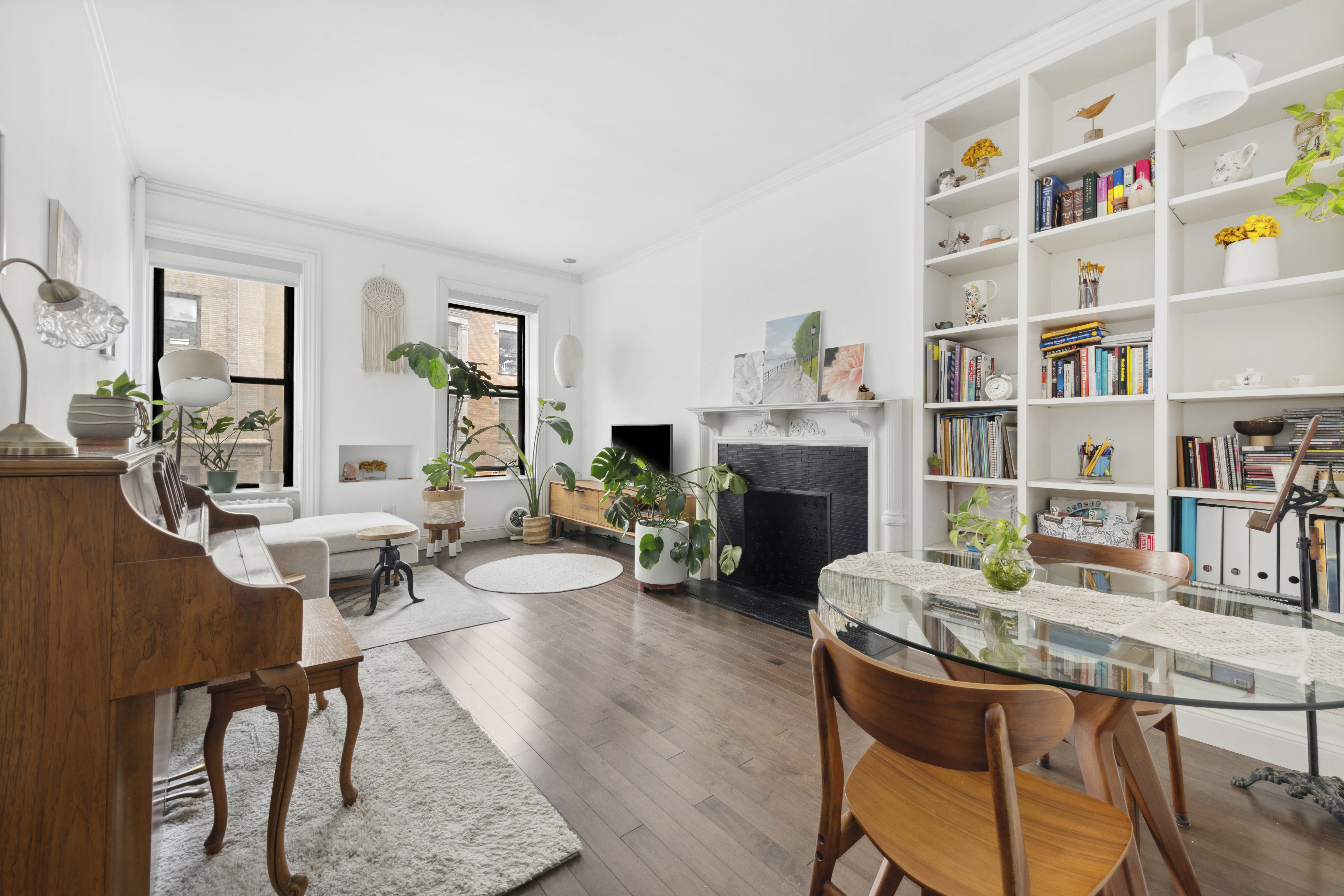332 West 101st Street, Unit 4F Manhattan, NY 10025 - Photo 3 of 10 a living room with furniture and a fireplace