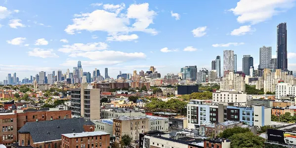 a view of a city with tall buildings