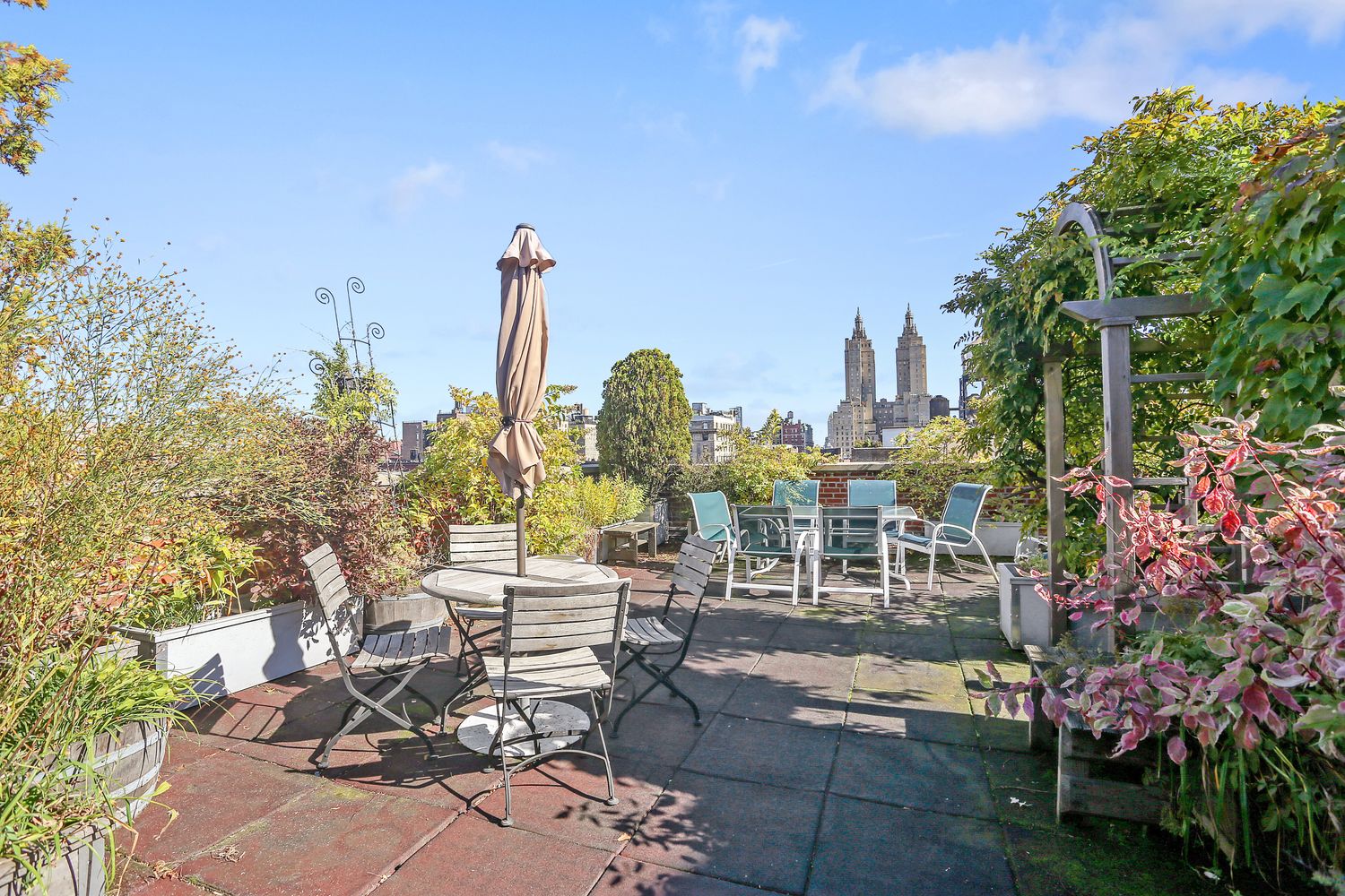 a view of a city with sitting area and furniture