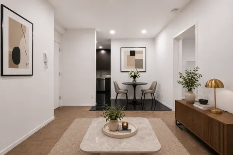 a kitchen with stainless steel appliances granite countertop a sink and a stove top oven