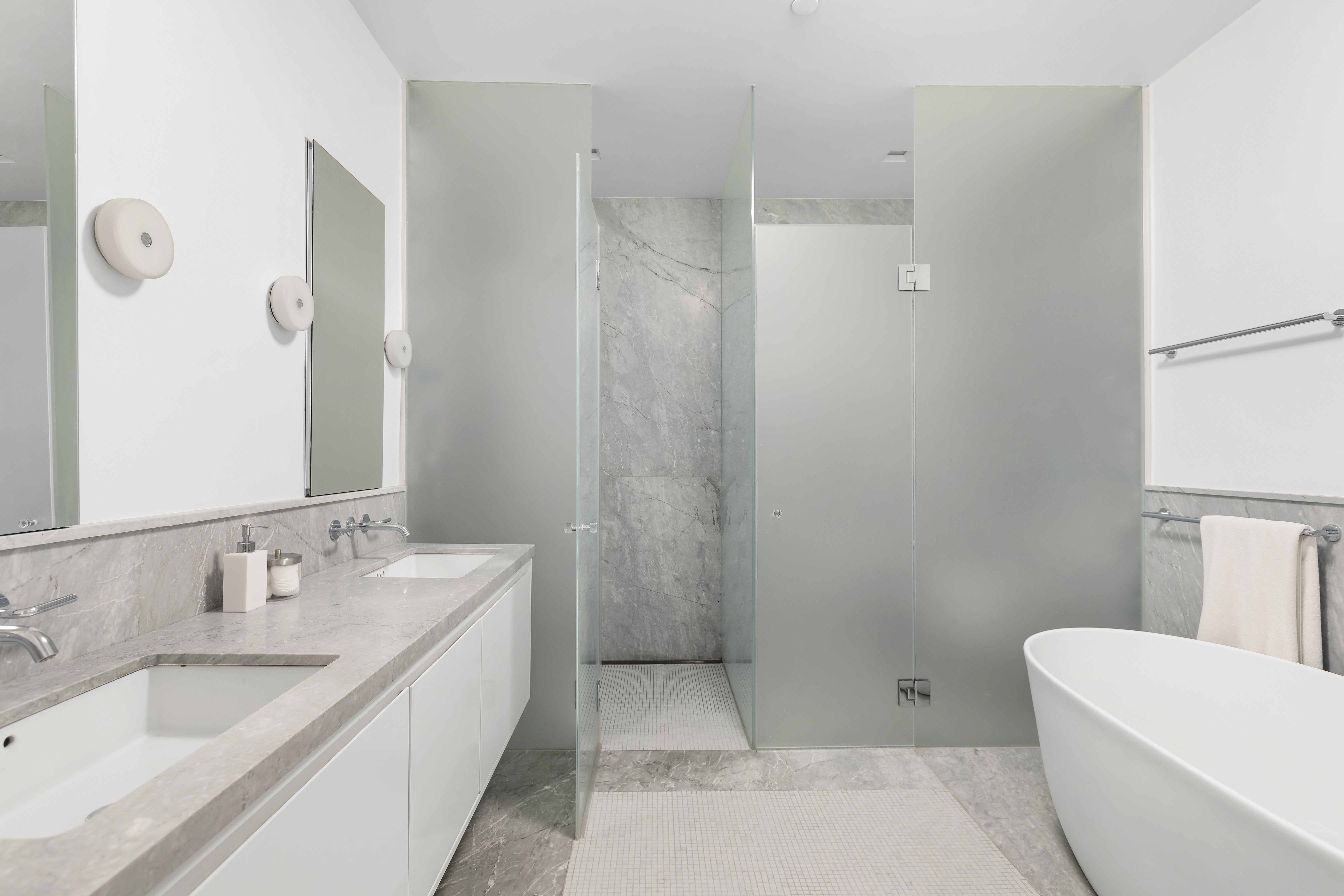 21 East 12th Street, Unit 5B Manhattan, NY 10003 - Photo 7 of 11 a bathroom with a tub sink toilet and mirror