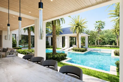 a view of a house with backyard porch and sitting area