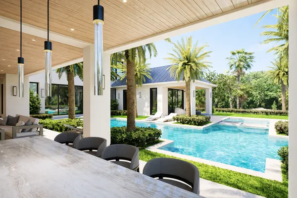 a view of a house with backyard porch and sitting area