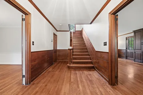 a view of an entryway with wooden floor