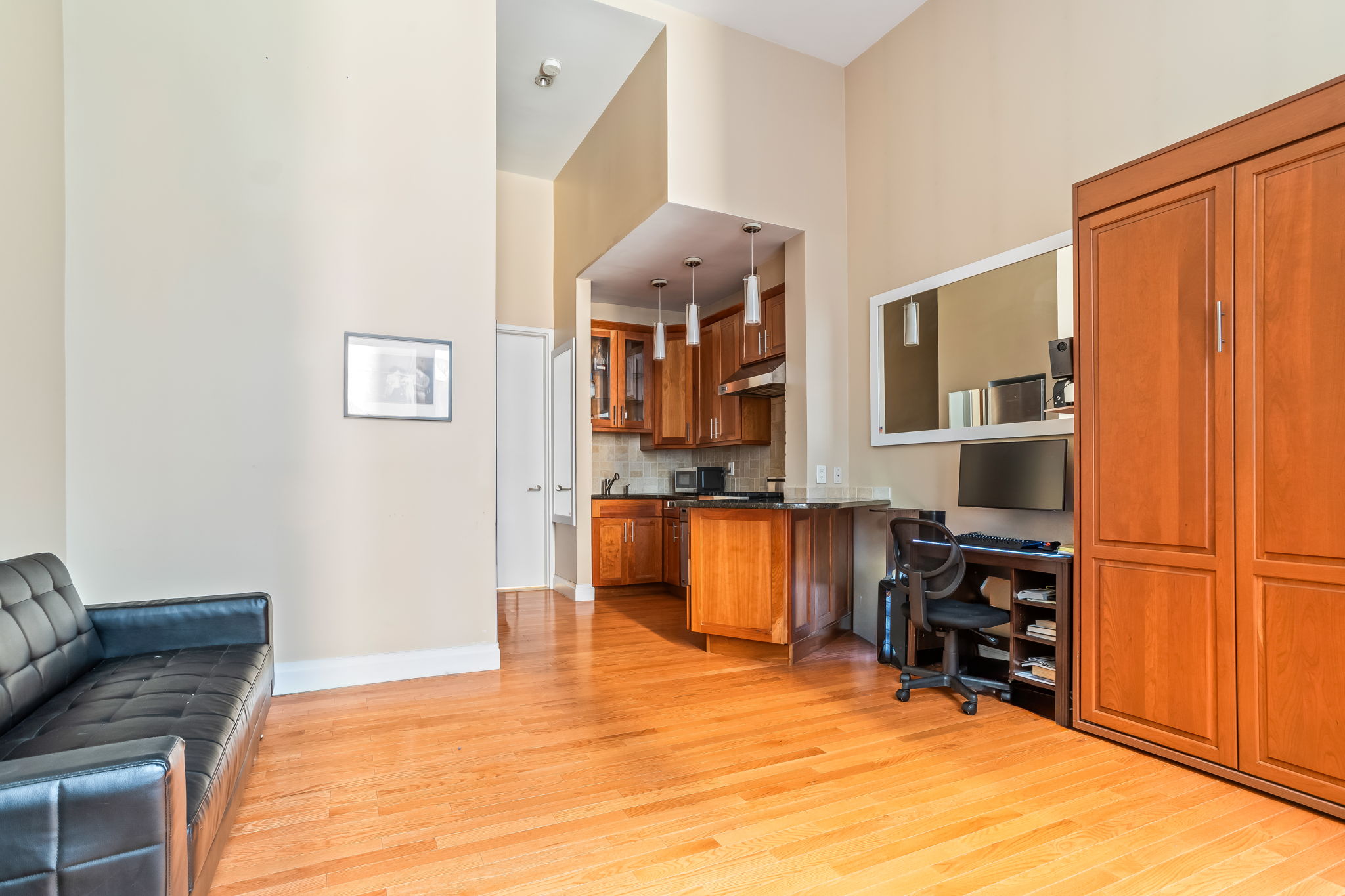 120 East 87th Street, Unit R6L Manhattan, NY 10028 - Photo 2 of 19 a view of kitchen and dining room with wooden floor