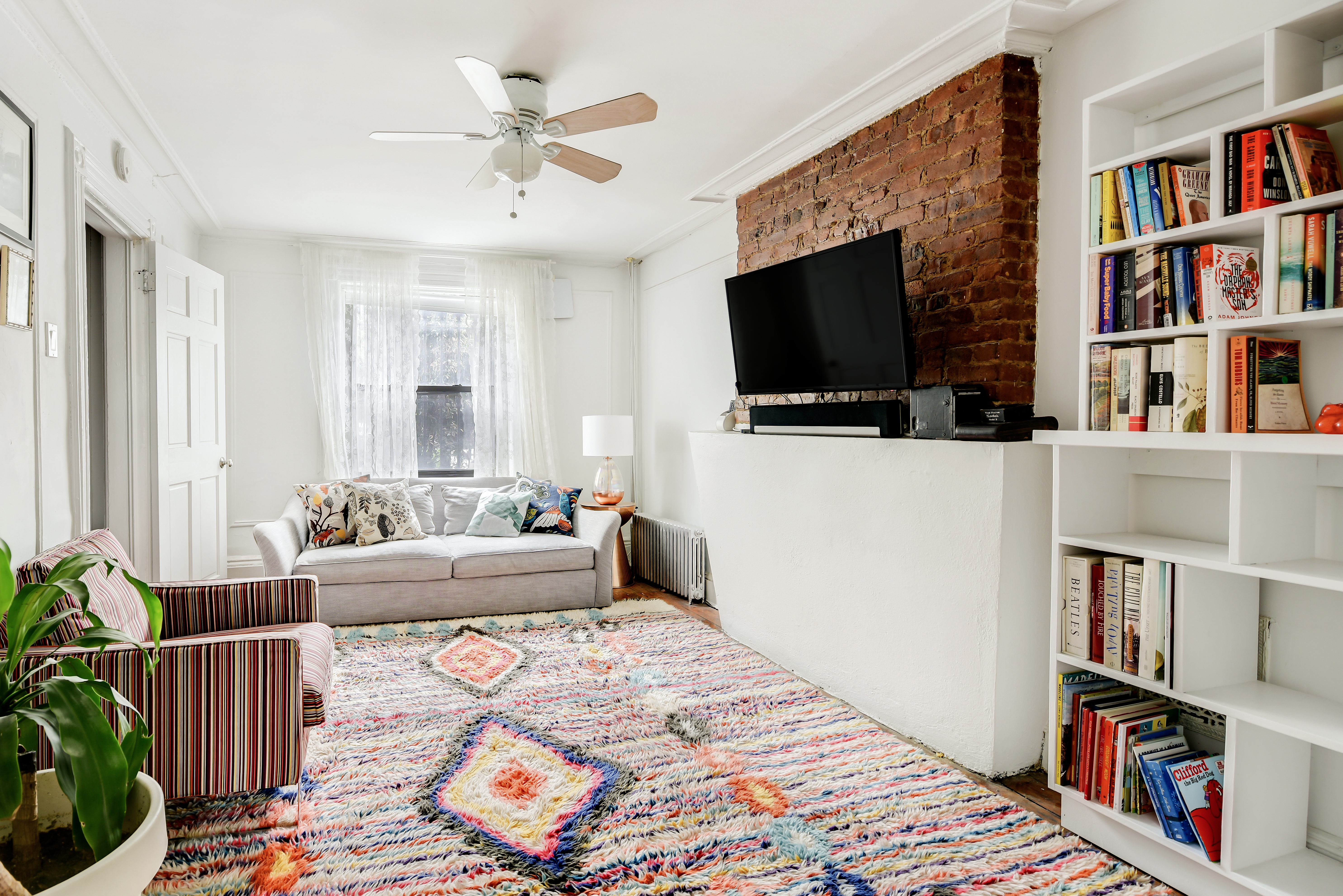 401 A Monroe Street, Unit 1 Brooklyn, NY 11221 - Photo 14 of 21 a living room with furniture and a flat screen tv