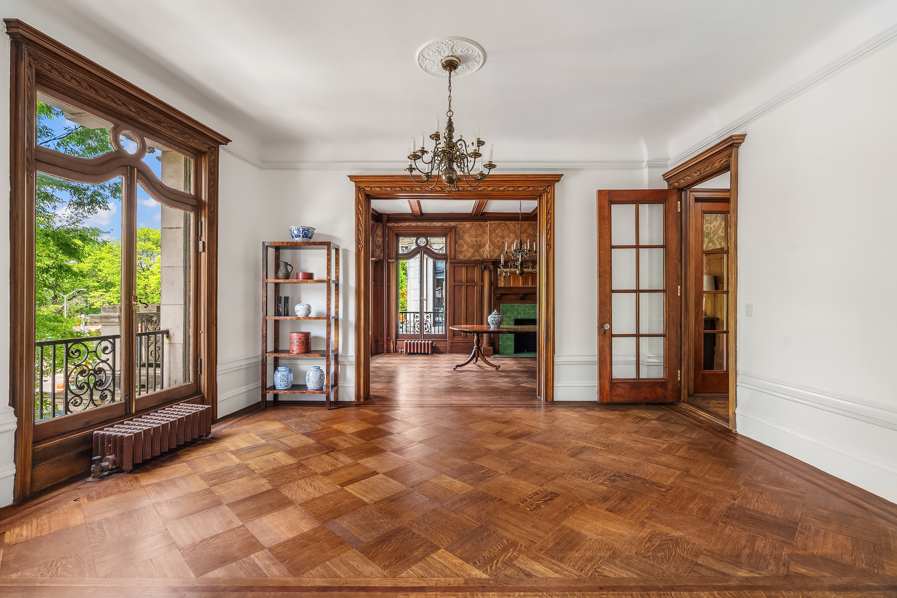 67 Riverside Drive, Unit 2AD Manhattan, NY 10024 - Photo 4 of 18 a view of a room with large windows and a chandelier