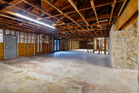 a view of a hall with wooden floor