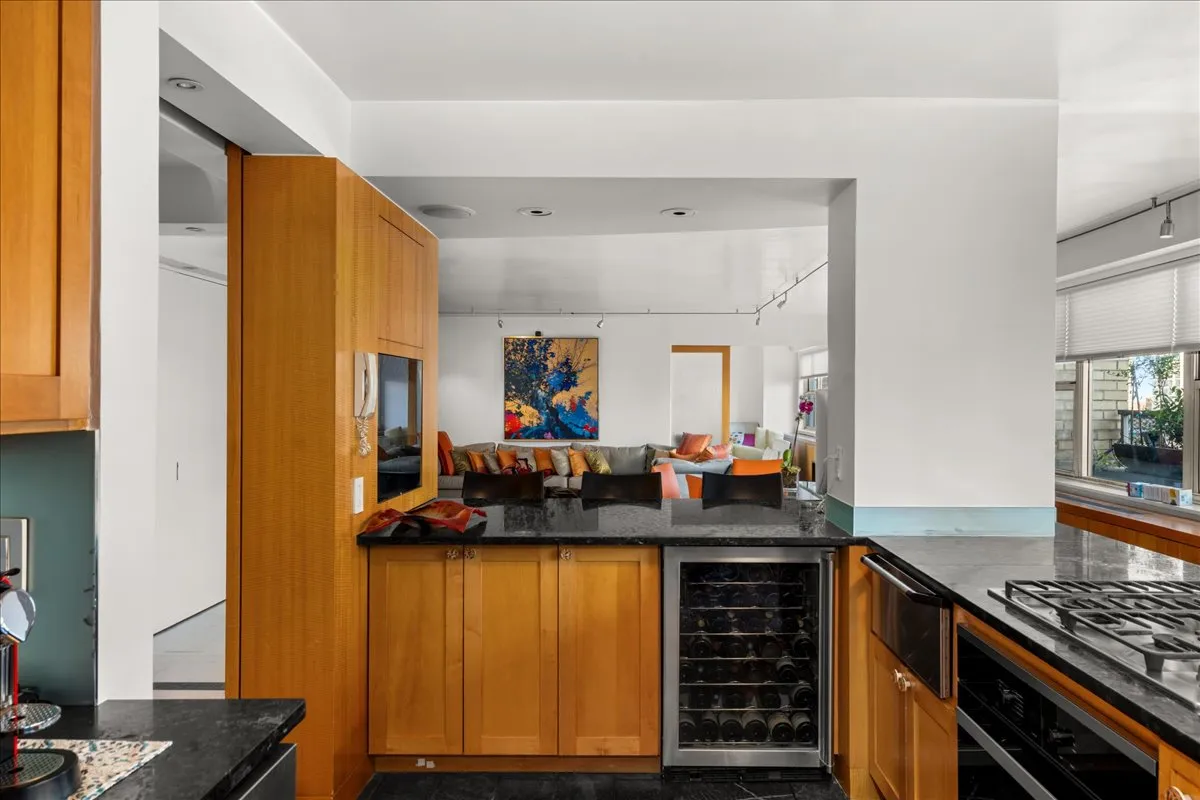 a kitchen with sink and refrigerator