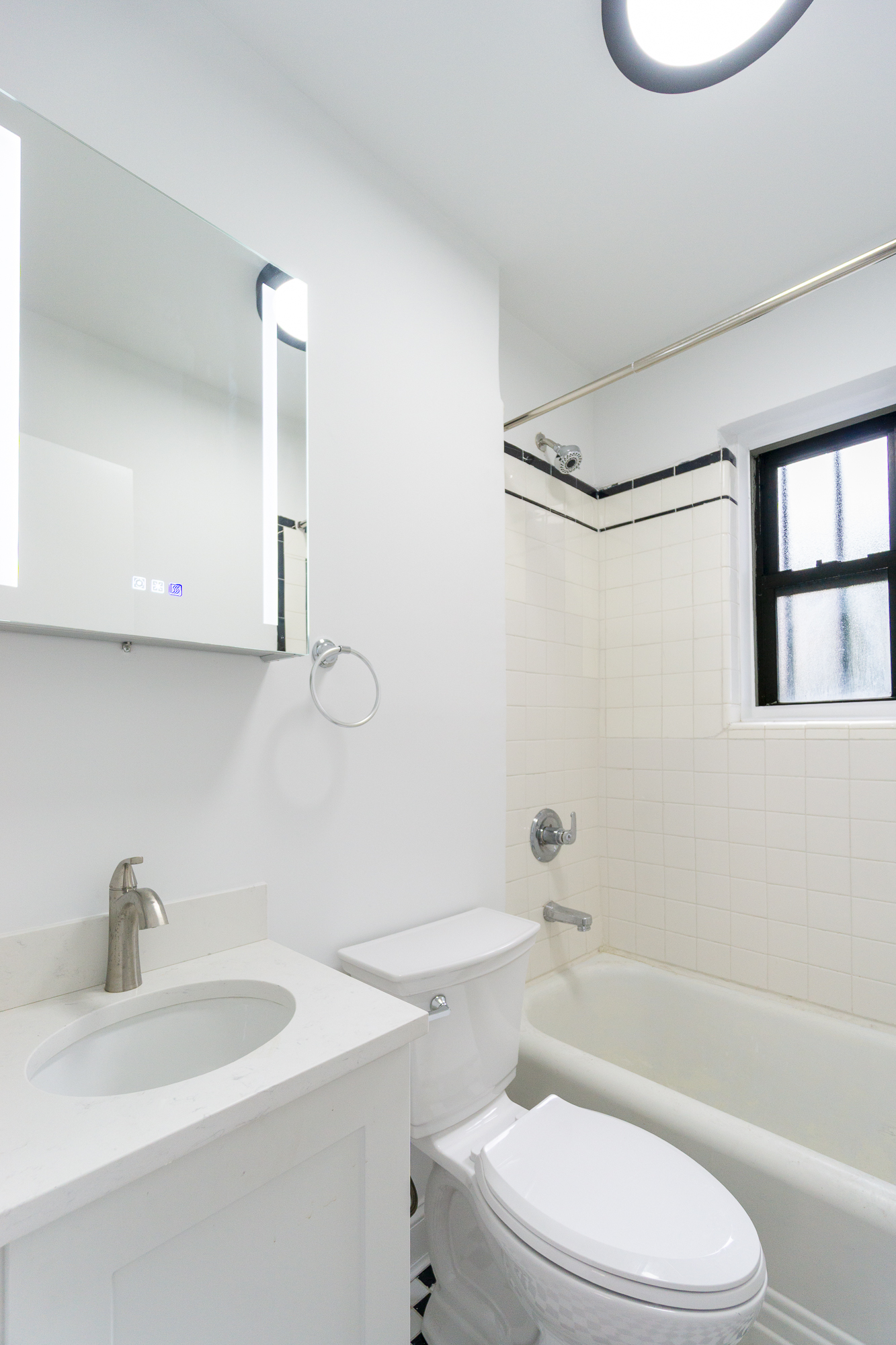 342 East 6th Street, Unit 3 Manhattan, NY 10003 - Photo 12 of 13 a bathroom with a sink a toilet and a bathtub