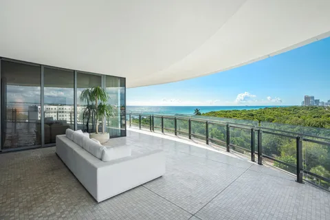 a balcony with furniture and city view
