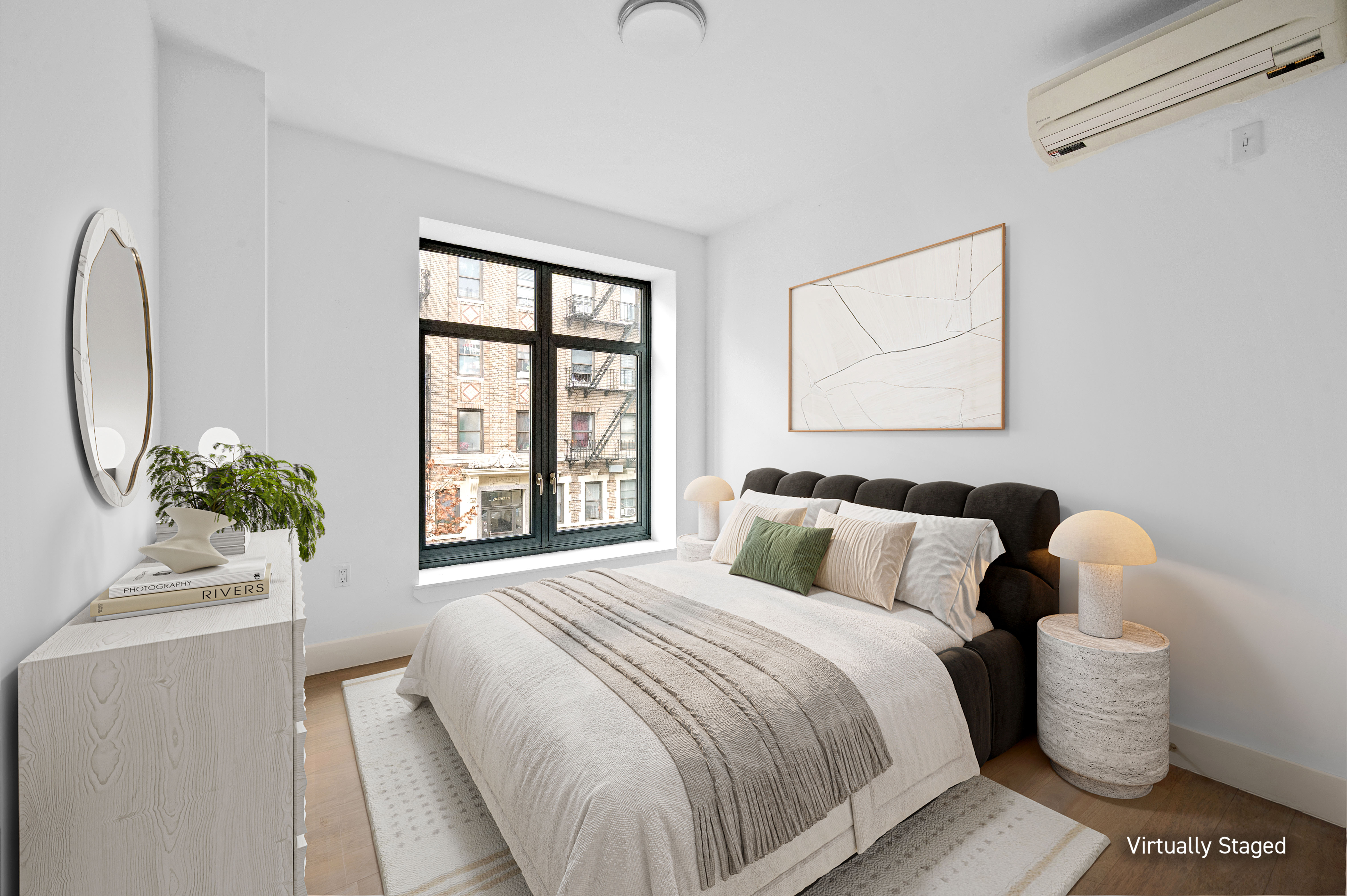 17 Convent Avenue Manhattan, NY 10027 - Photo 11 of 15 a bedroom with a bed and a window