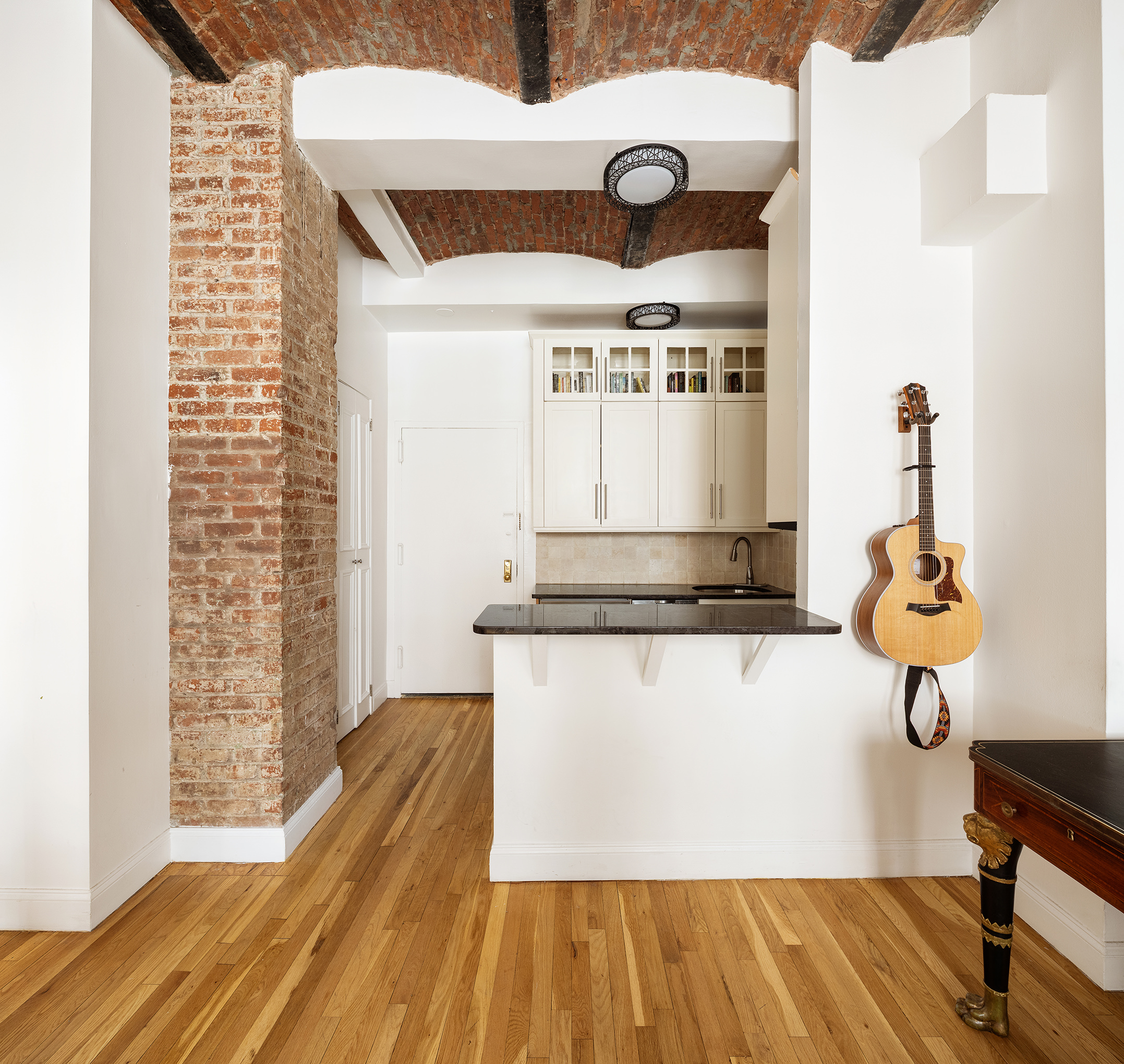 9 Barrow Street, Unit 6D Manhattan, NY 10014 - Photo 2 of 9 a view of a kitchen with a wooden floor