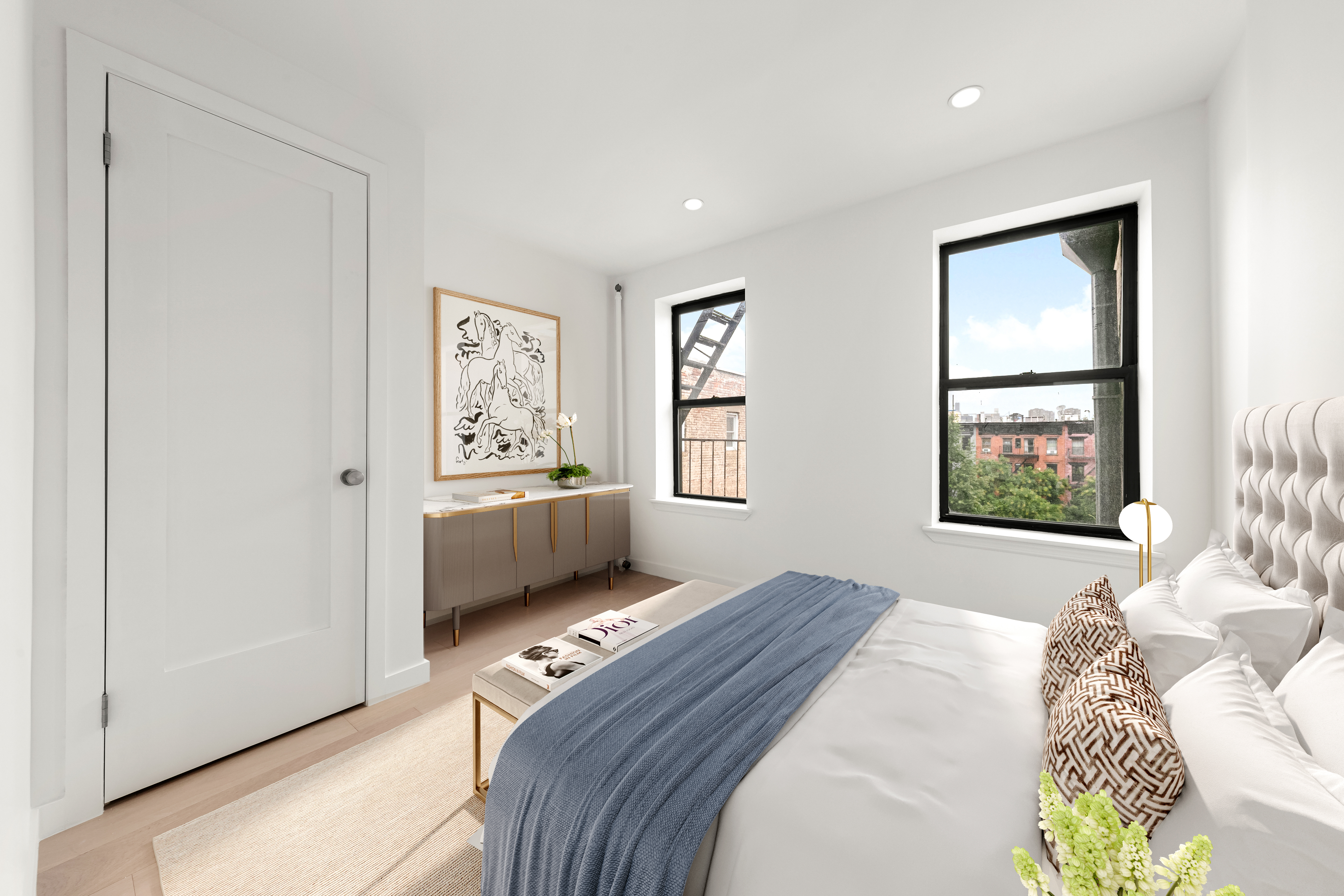 177 East 3rd Street, Unit 2A Manhattan, NY 10009 - Photo 5 of 8 a bedroom with a bed and a window
