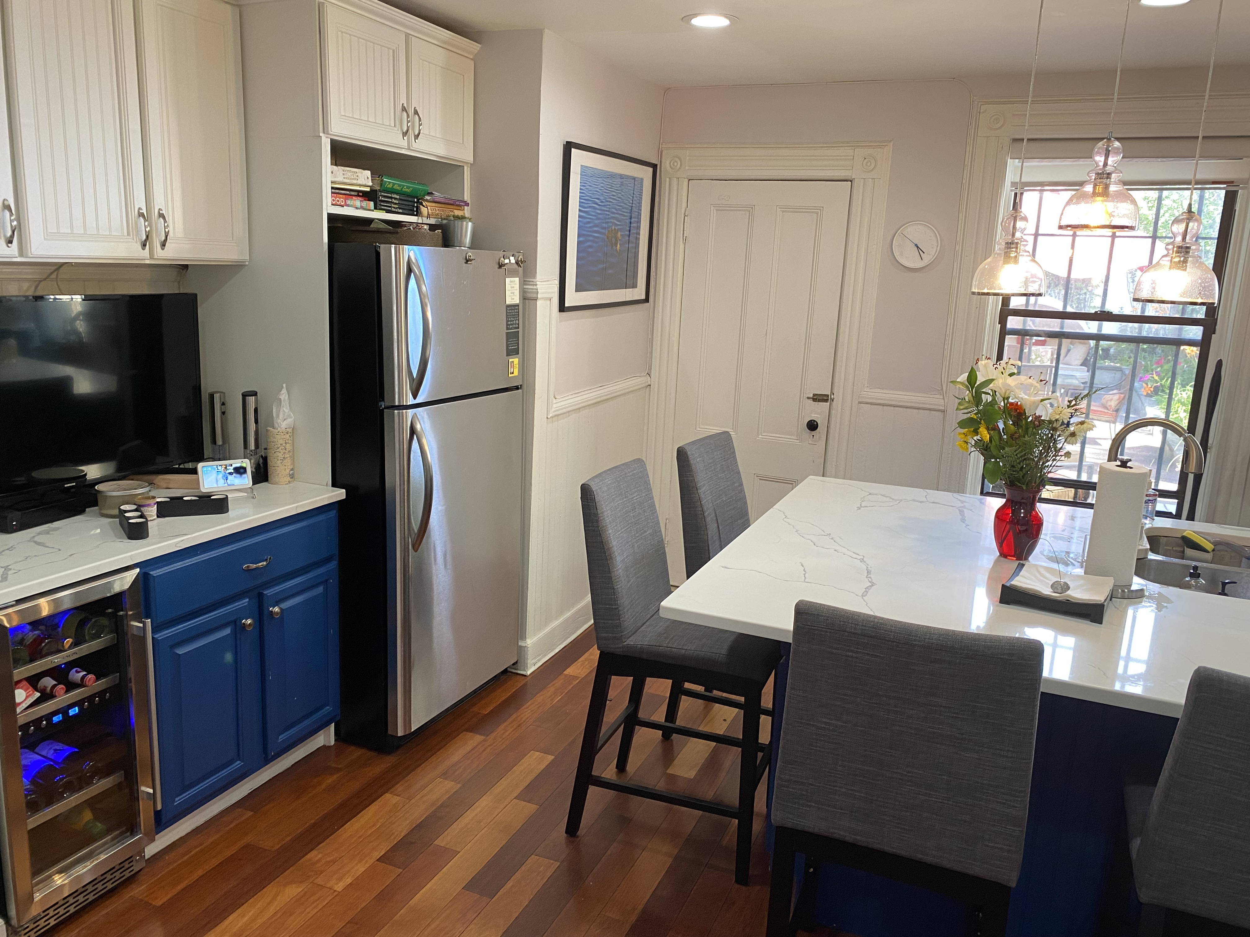 493 Decatur Street, Unit 1 Brooklyn, NY 11233 - Photo 17 of 26 a kitchen with stainless steel appliances granite countertop a dining table chairs refrigerator and sink